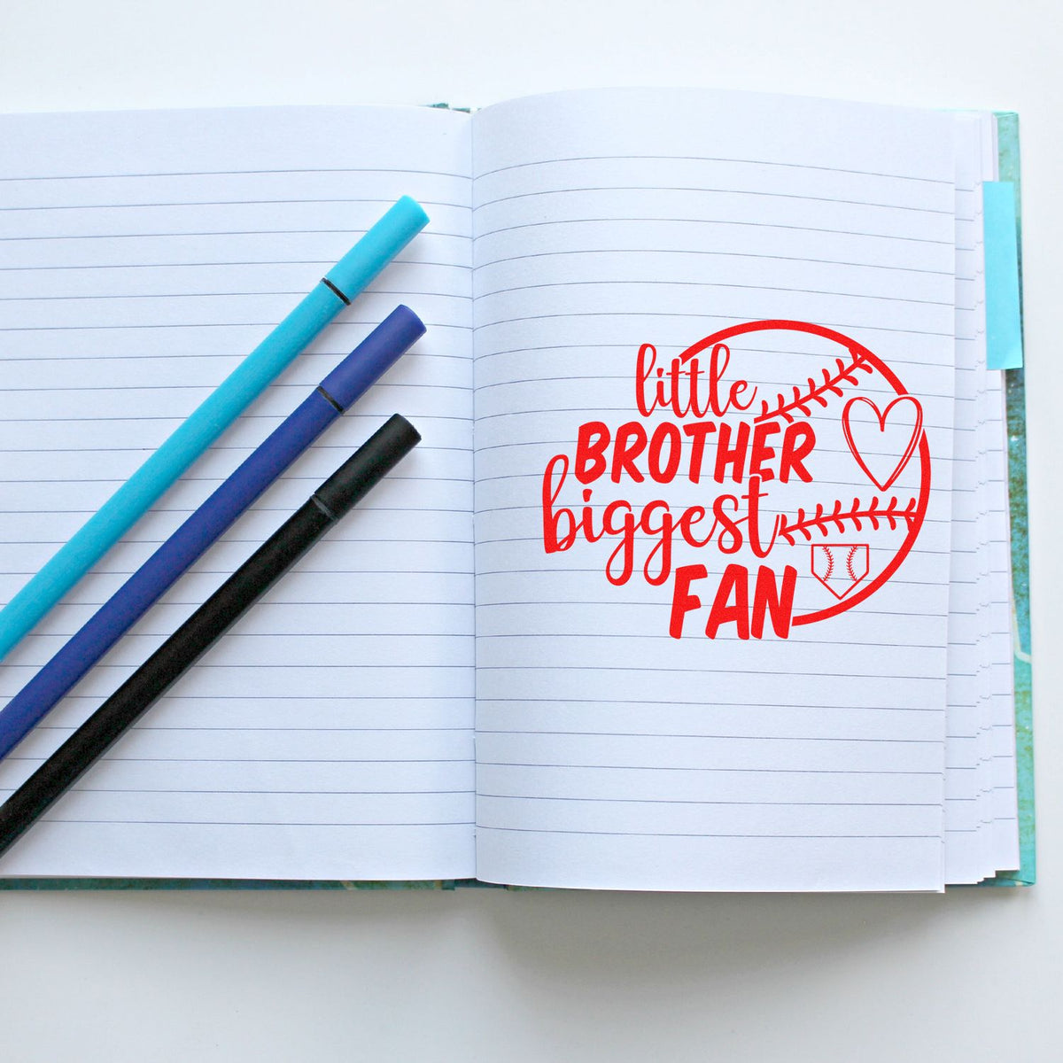 Little Brother Biggest Fan baseball rubber stamp on lined notebook page for scrapbooking, journaling, and handmade cards.