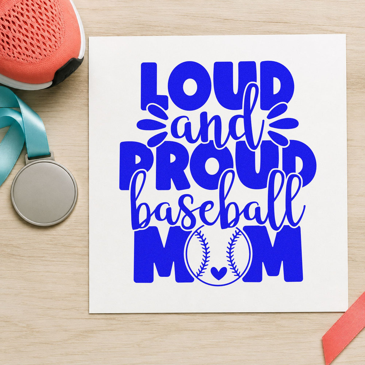 Proud Baseball Mom craft stamp imprinted in blue ink on paper, a design suited to mother's day cards.