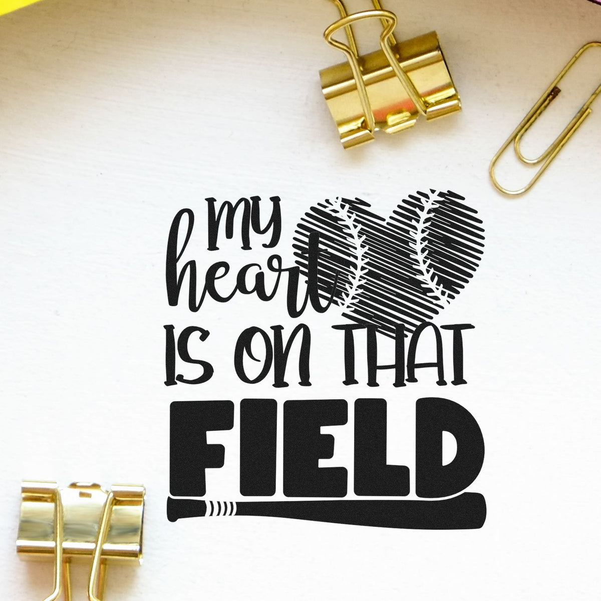 Baseball rubber stamp design reading My heart is on that field with heart-shaped baseball graphic and bat.