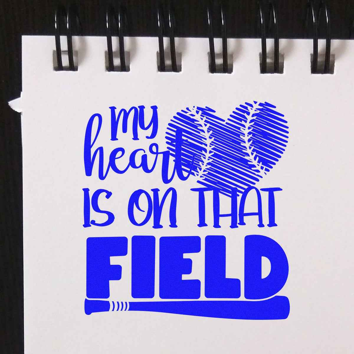 Custom baseball rubber stamp design reading "my heart is on that FIELD" with a heart-shaped ball and bat.