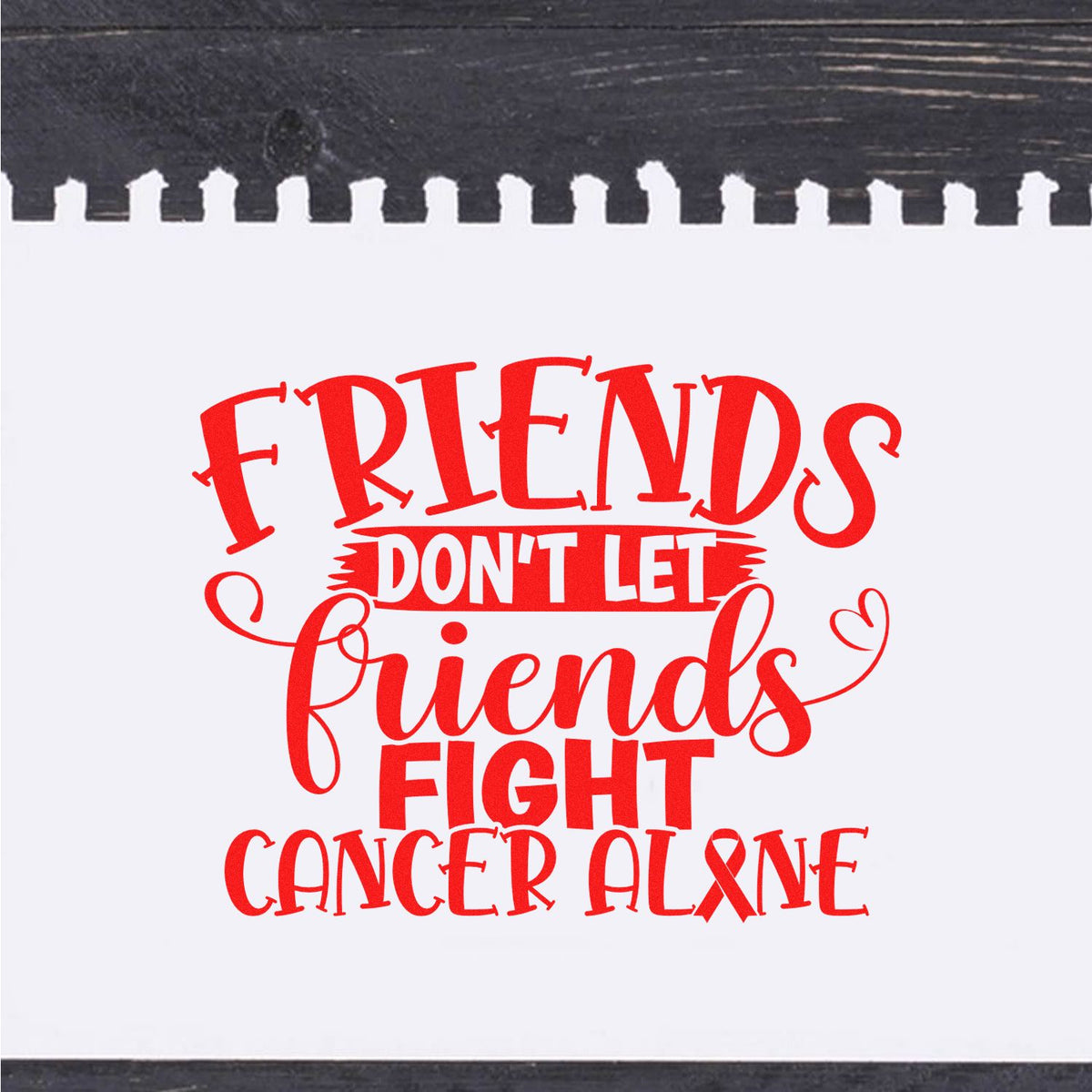 Cancer support rubber stamp reading Friends dont let friends fight cancer alone with awareness ribbon.