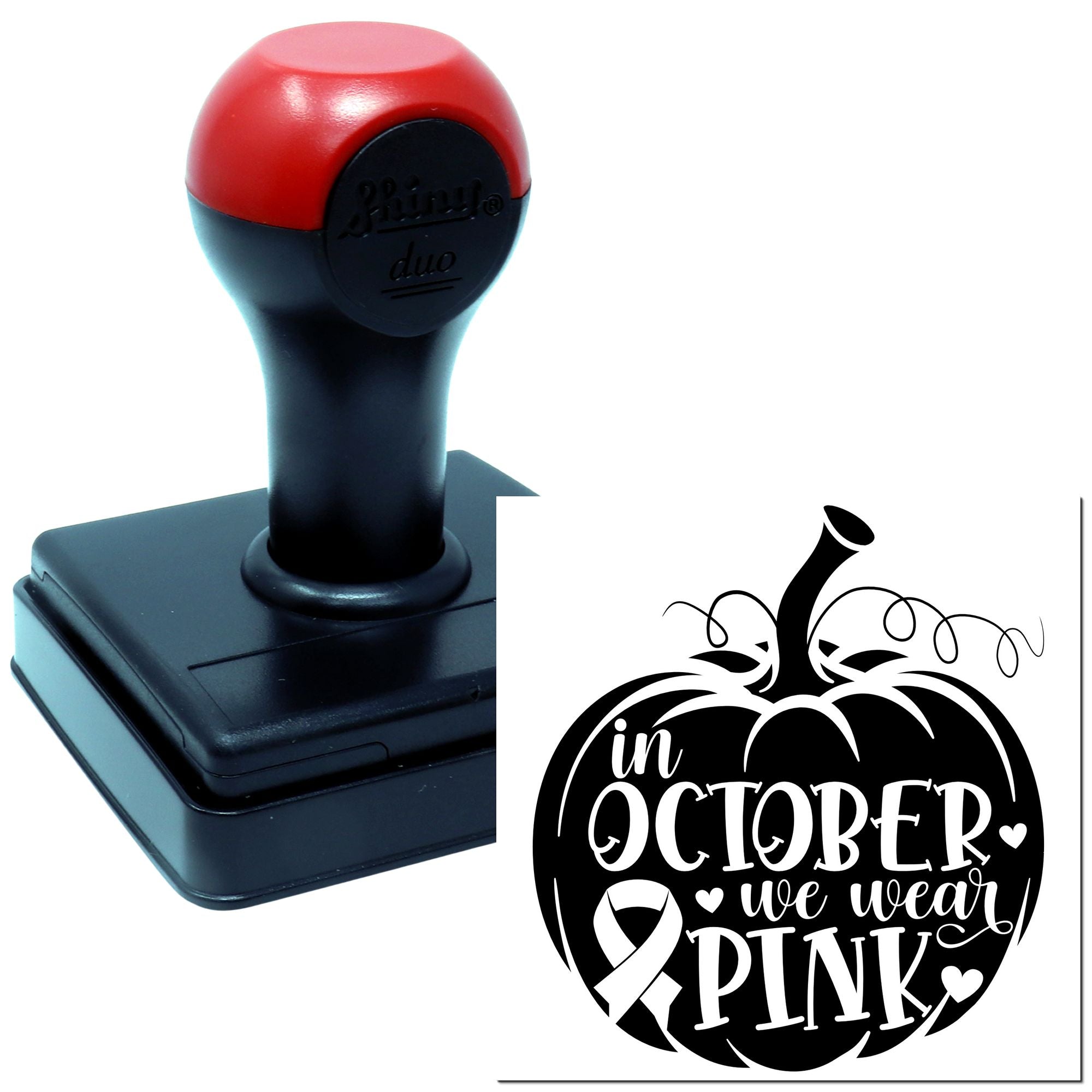 Self-inking rubber stamp with In October We Wear Pink pumpkin and pink ribbon design for breast cancer awareness.