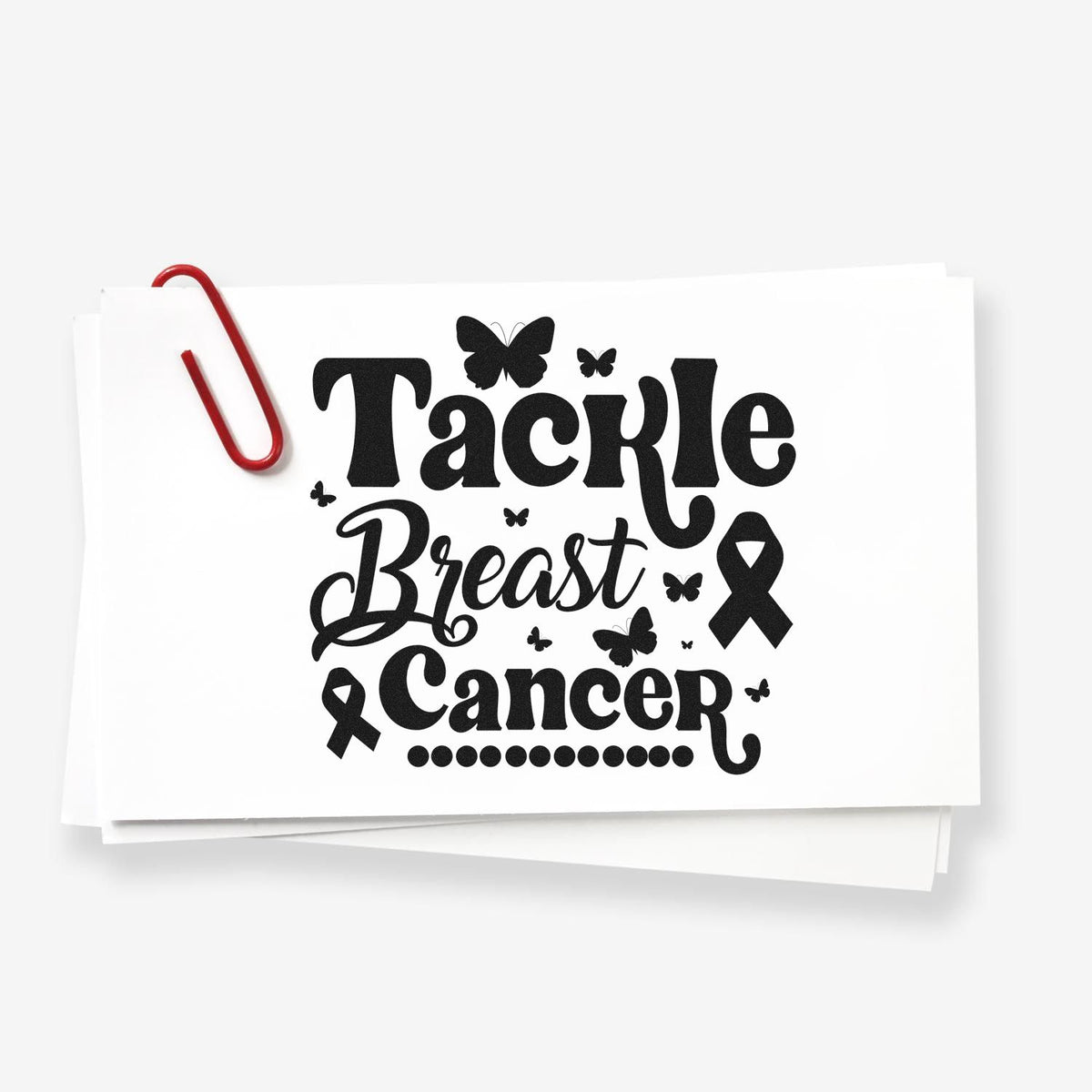Tackle Breast Cancer Butterflies PSI Pre-Inked Stamp imprint stamped in black ink. Butterflies, hearts, and awareness ribbons surround "Tackle breast cancer" in decorative lettering.