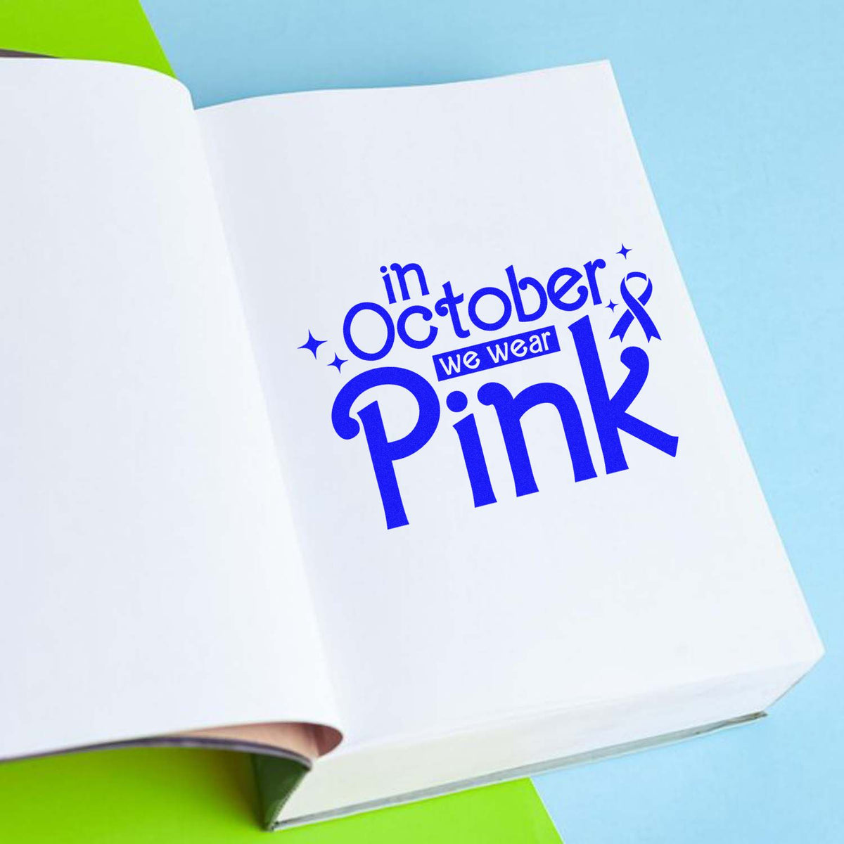 Custom rubber stamp design reading In October We Wear Pink for breast cancer awareness notebooks, cards and events.