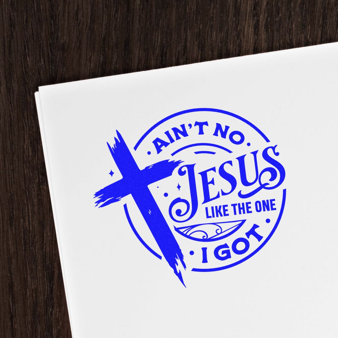 Blue Christian rubber stamp design with cross and Aint No Jesus Like the One I Got on white paper.