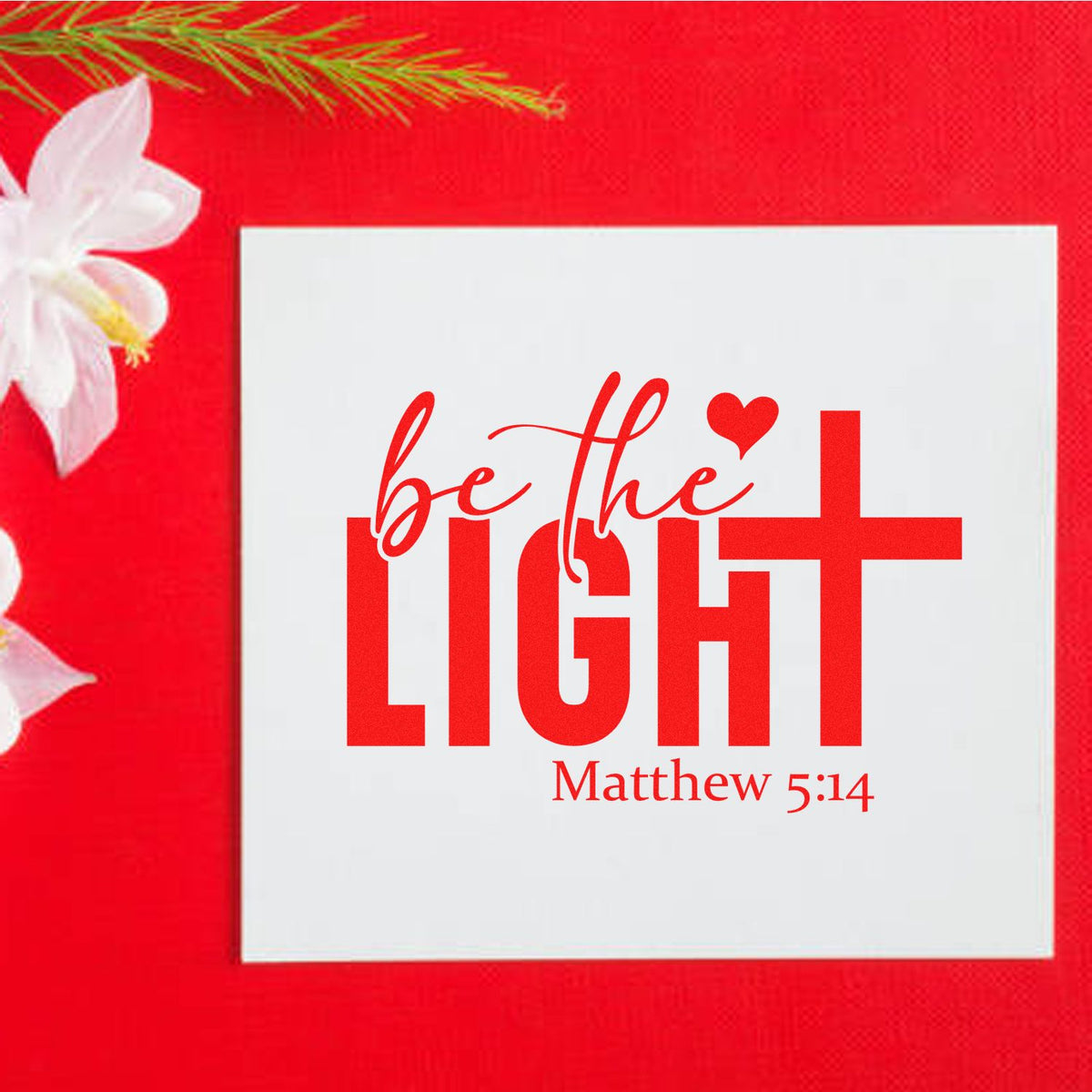 Christian rubber stamp design with Be the Light and Matthew 5:14 scripture in red on a white card with floral background.
