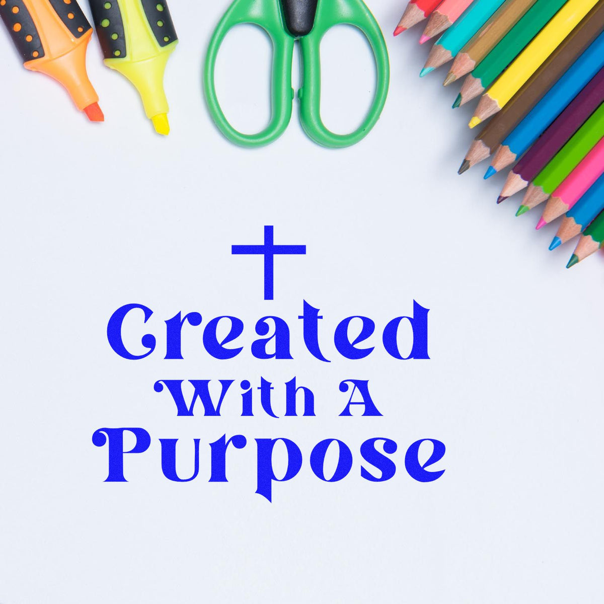 Inspirational rubber stamp design reading Created With a Purpose with colorful pens, pencils and craft scissors.
