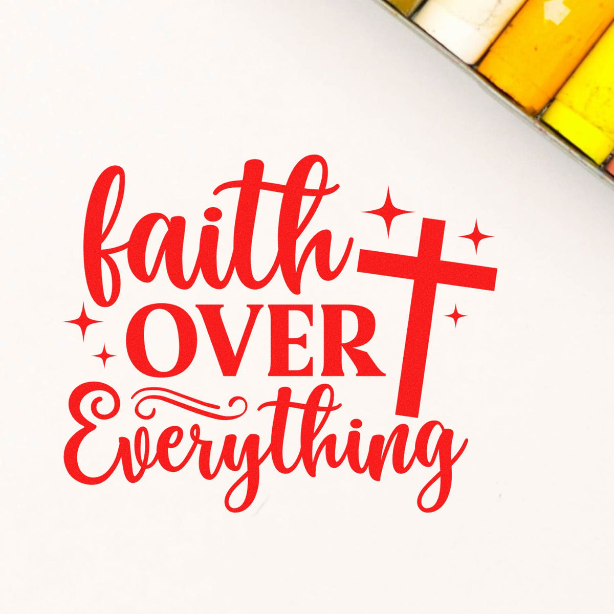Faith over Everything red rubber stamp design with cross and sparkles for inspirational Christian craft projects.
