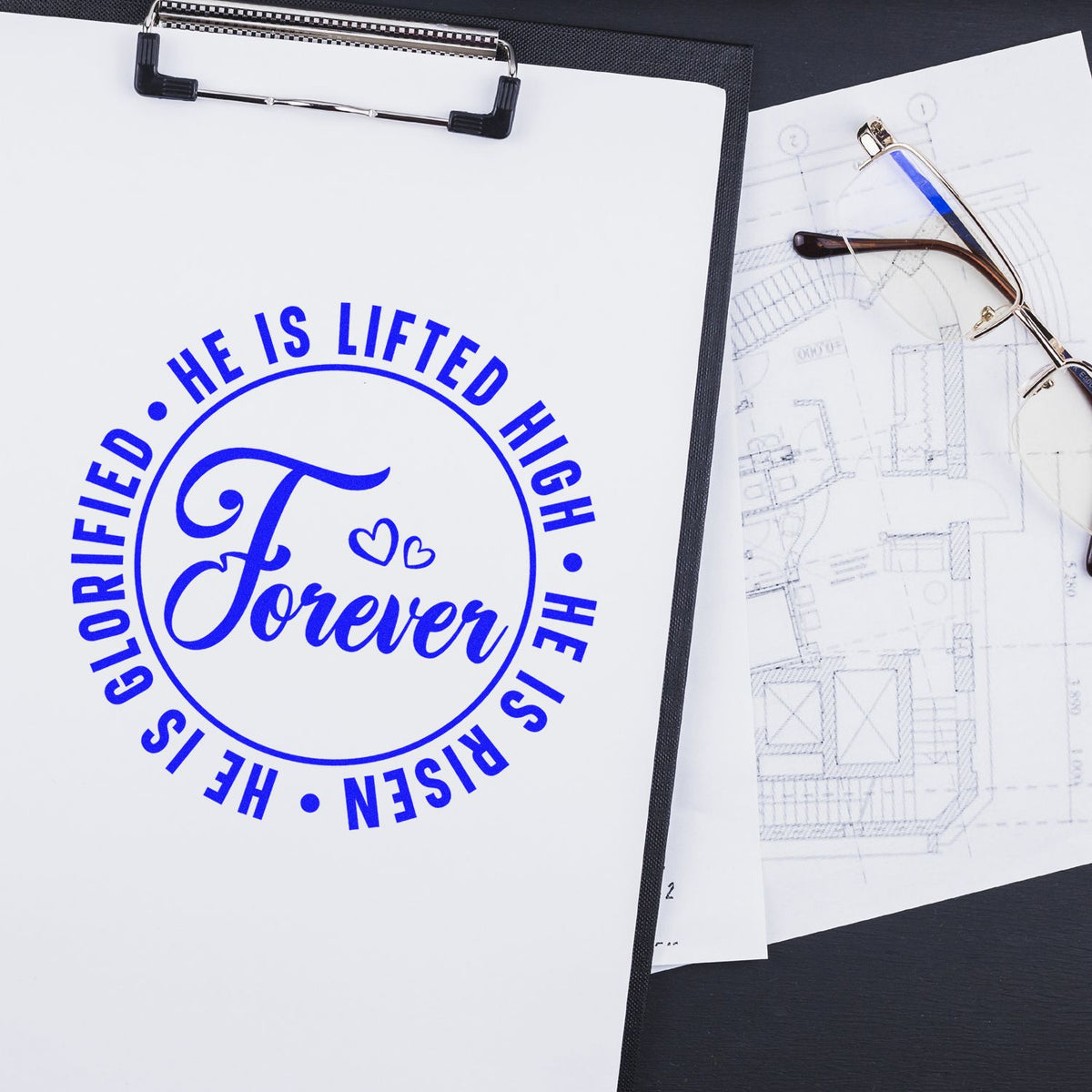 Christian rubber stamp with He Is Risen, He Is Lifted High, Glorified Forever in blue on paper, ideal for Easter crafts.