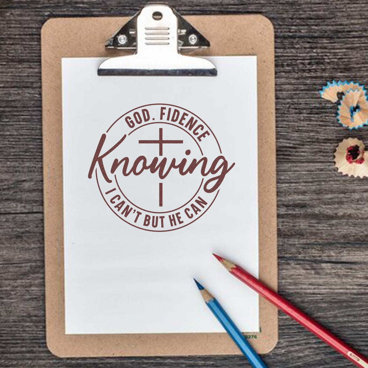 Christian rubber stamp design with cross and inspirational quote, God. FIDENCE Knowing I cant but He can, on clipboard.