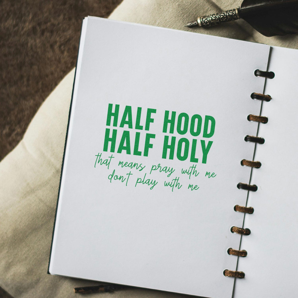 Half Hood Half Holy rubber stamp on a notebook page with green lettering and playful text, pray with me, dont play with me.