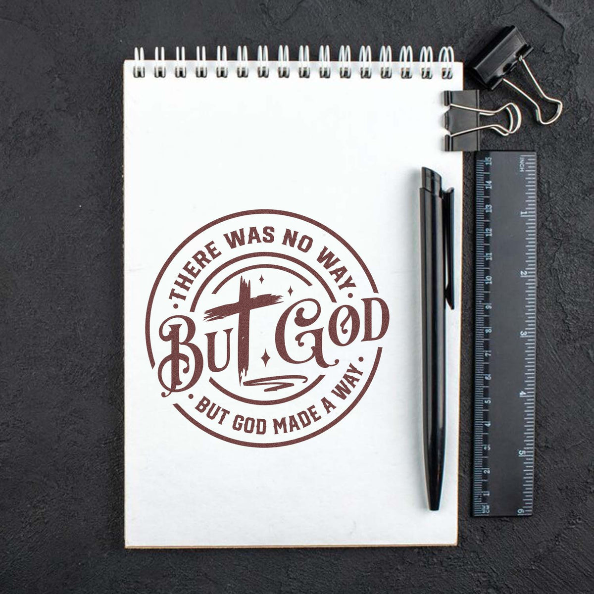 Christian rubber stamp design with There Was No Way, But God Made a Way quote on notebook mockup.