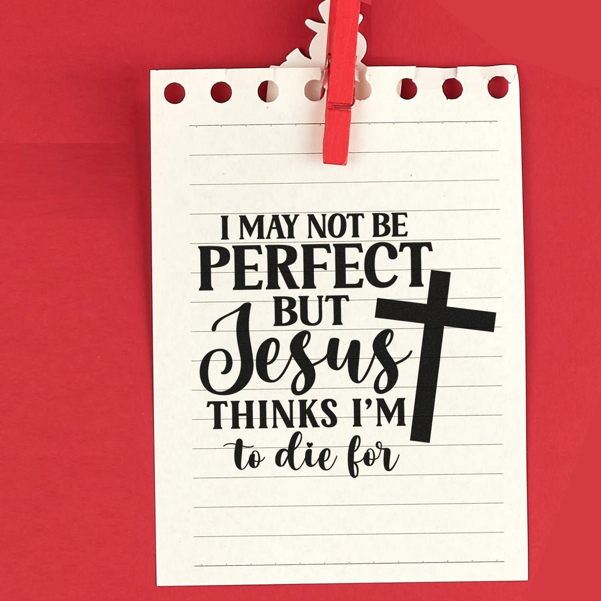 Religious rubber stamp design with quote, I may not be perfect but Jesus thinks Im to die for, with cross on notepad.