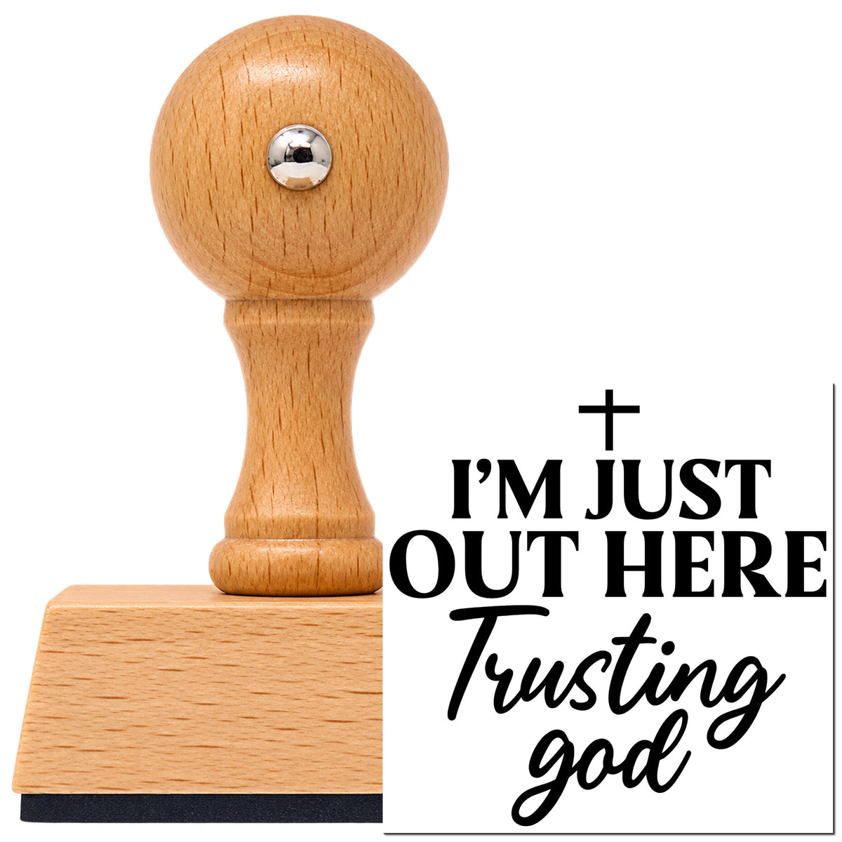 Out Here Trusting God Vintage Pro rubber stamp in European beech wood with a round knob handle, shown beside its black imprint.