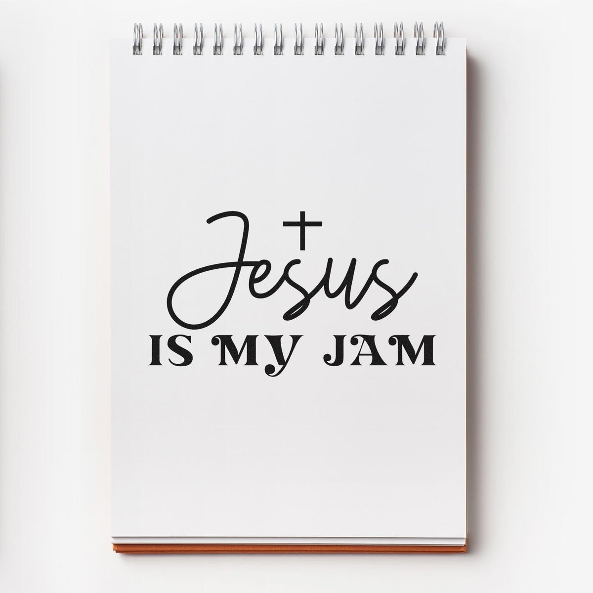 Jesus is My Jam rubber stamp design on spiral notebook for Christian crafts, Bible journaling, and faith-based gifts.