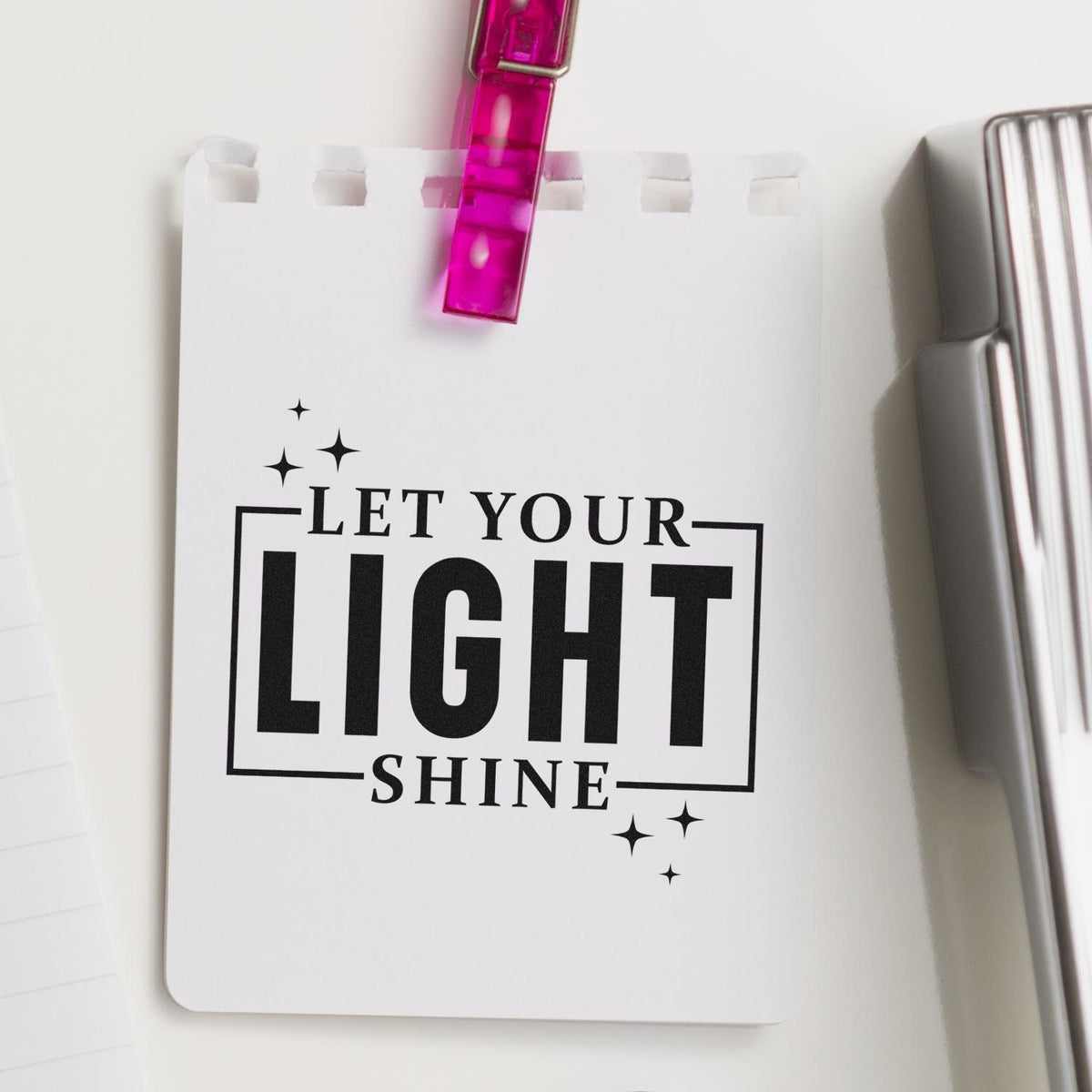 Custom rubber stamp impression with Let Your Light Shine inspirational quote, perfect for crafts, branding, and stationery.