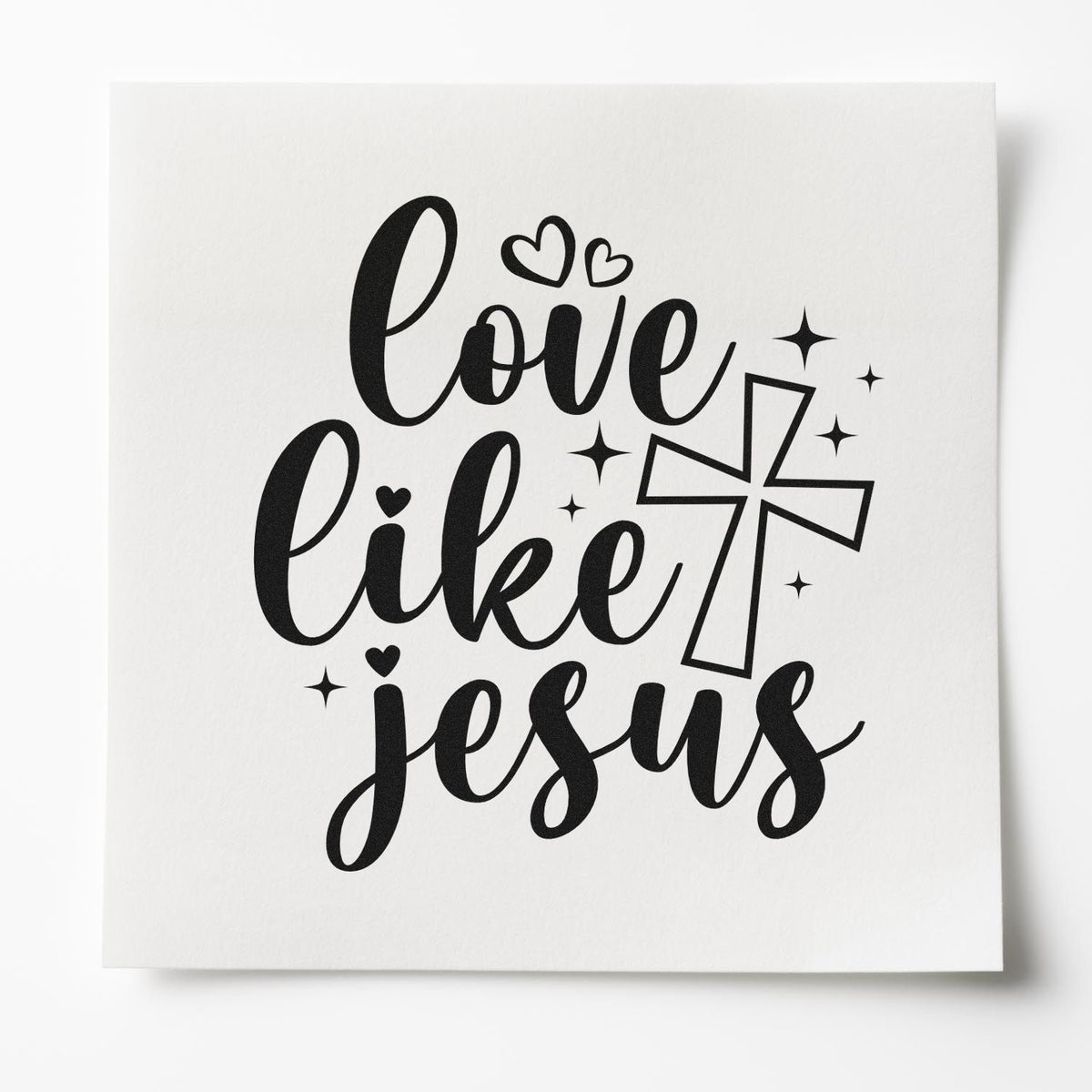 Love Like Jesus Christian rubber stamp design with cross, hearts, and sparkles on white paper