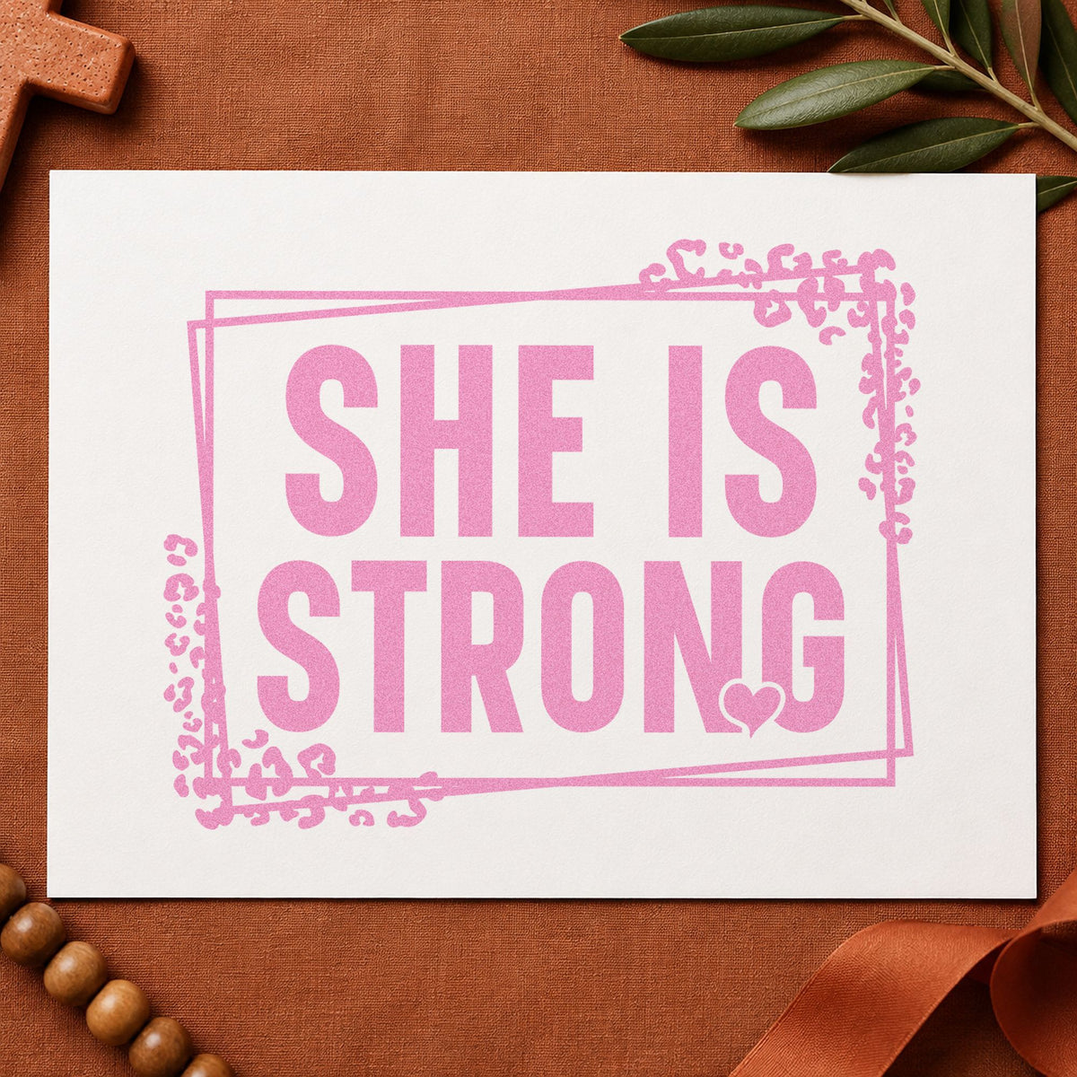 She Is Strong craft stamp in purple ink on cardstock, an easy option for survivor gifts.