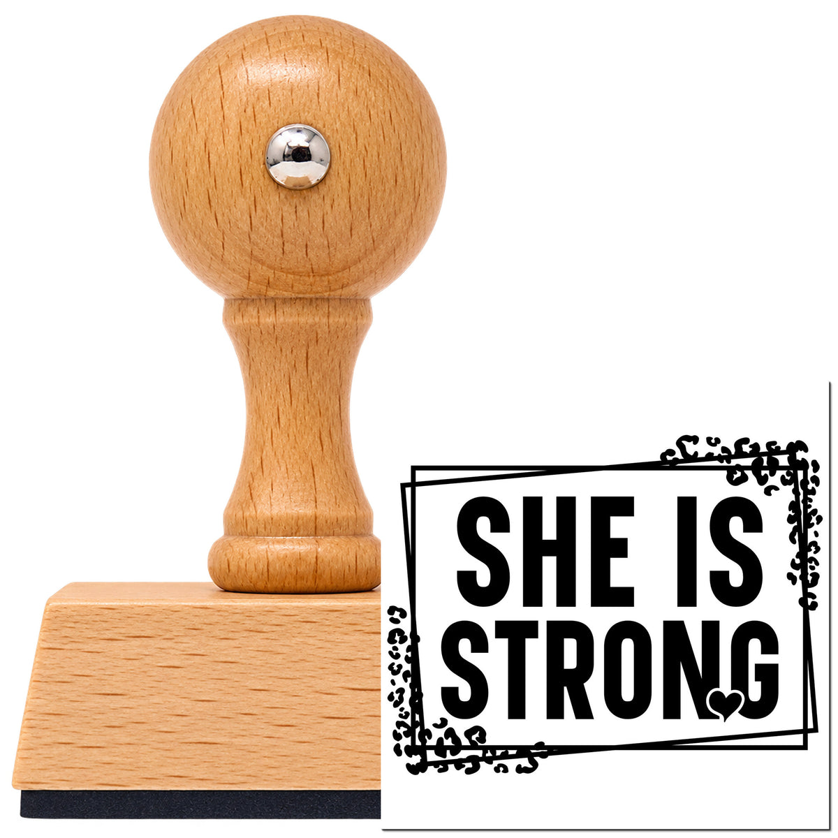 She Is Strong Vintage Pro rubber stamp in European beech wood with a round knob handle, shown beside its black imprint.