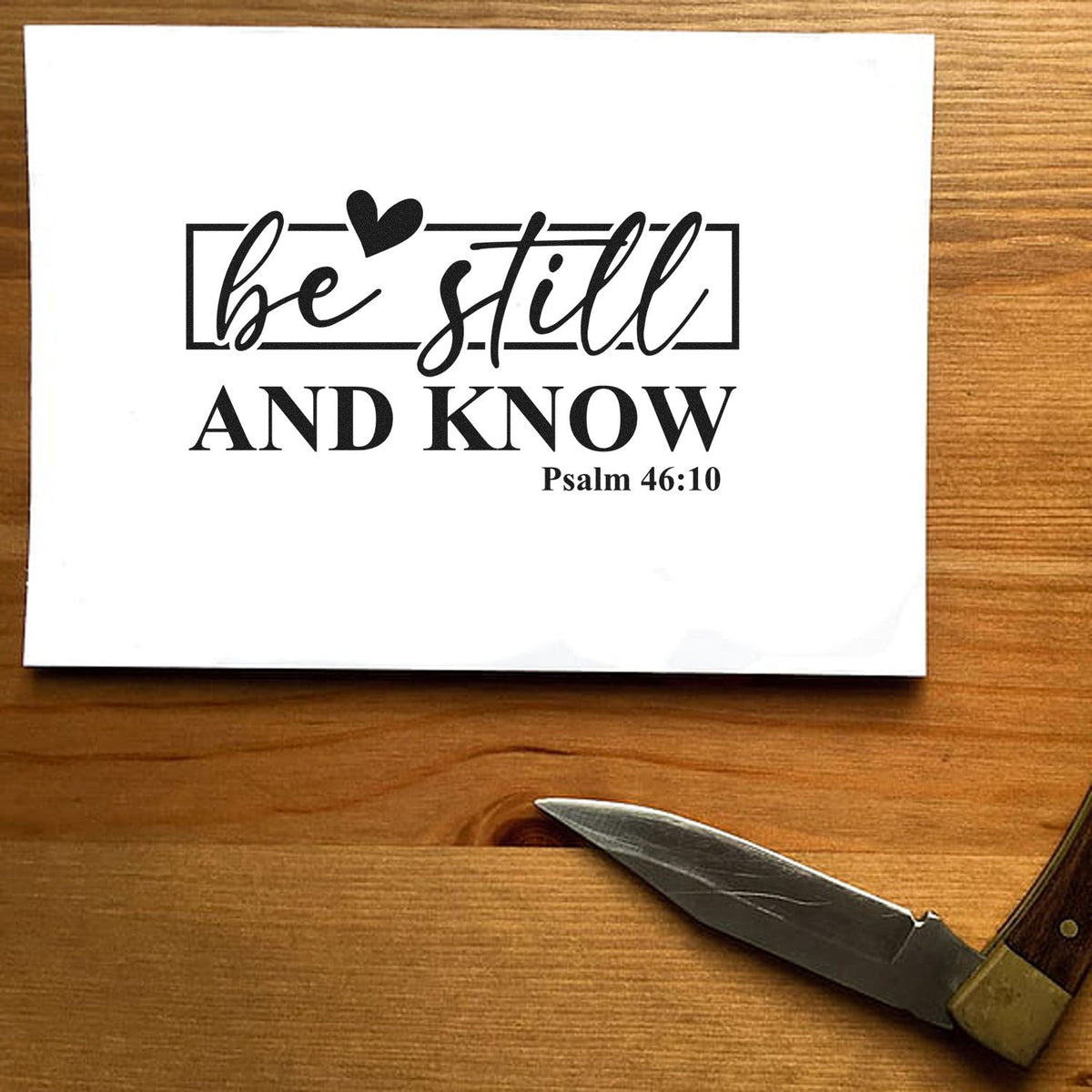 Bible verse rubber stamp design reading Be Still and Know with Psalm 46:10 for faith-based crafts.
