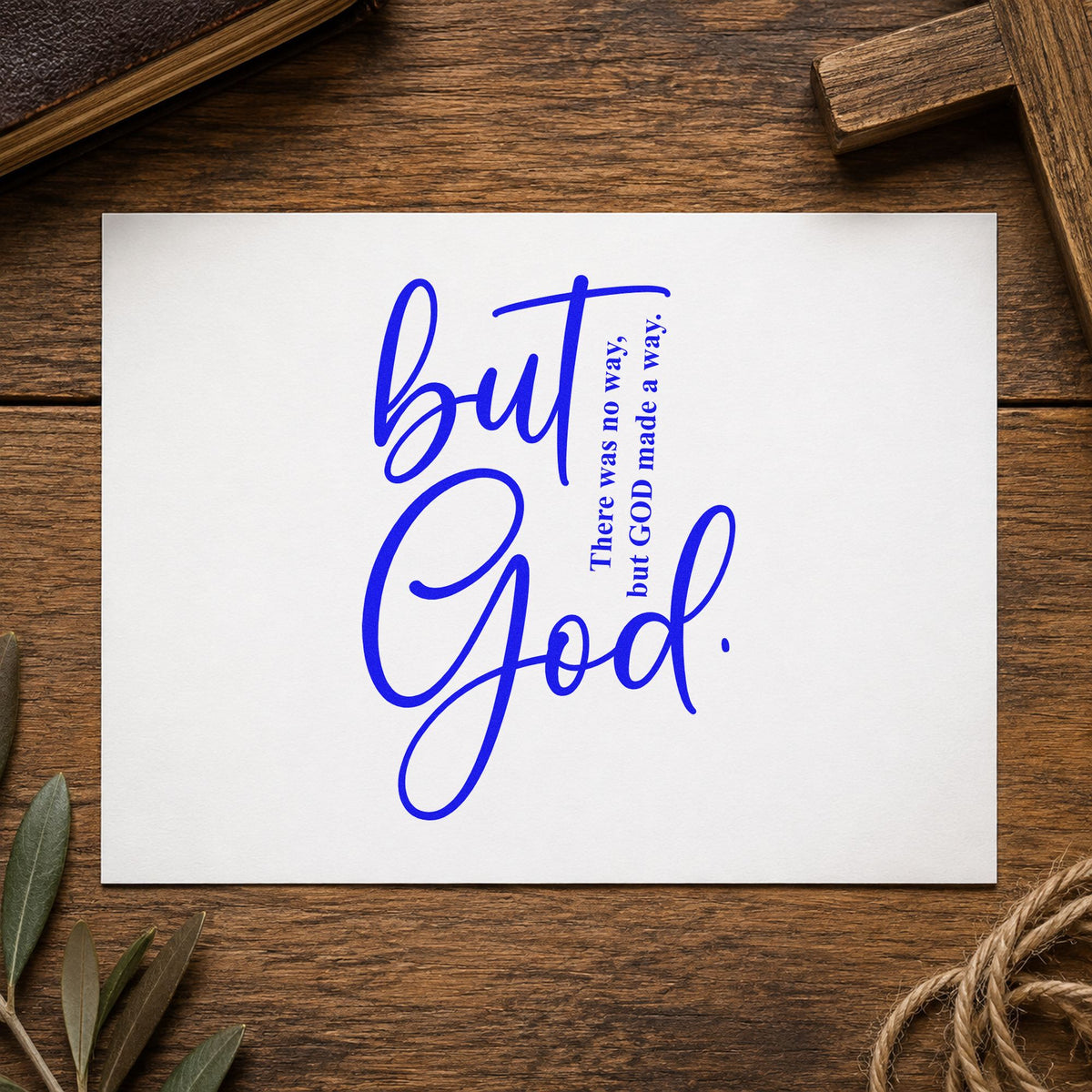 But God Script craft stamp imprinted in blue ink on paper, a design suited to framed living room art.