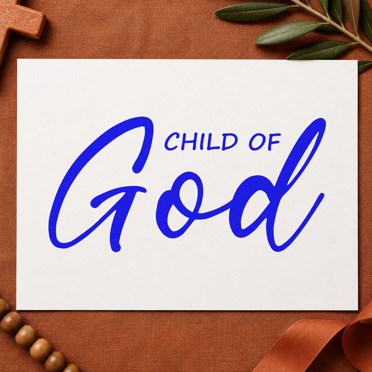Child of God Script craft stamp imprinted in blue ink on paper, a design suited to adoption announcements.