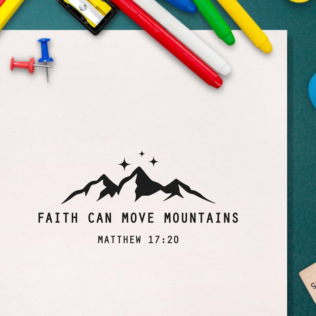 Christian rubber stamp with mountain graphic and Bible verse, Faith Can Move Mountains from Matthew 17:20.