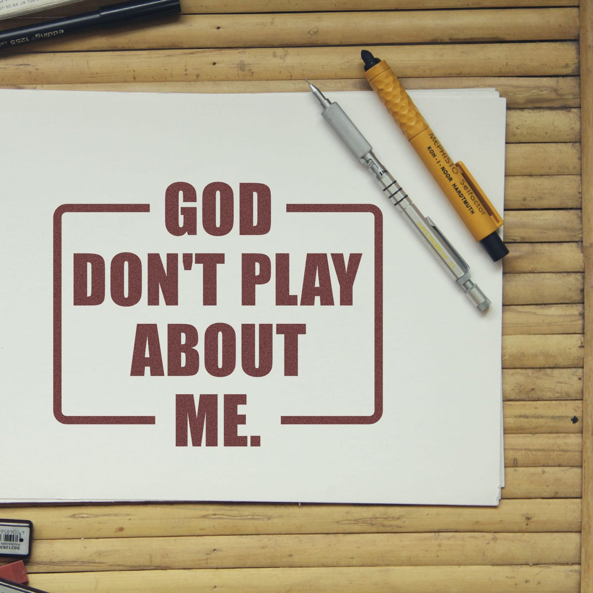 Custom rubber stamp design with bold text God Dont Play About Me on paper, ideal for religious quote stamps and craft branding.