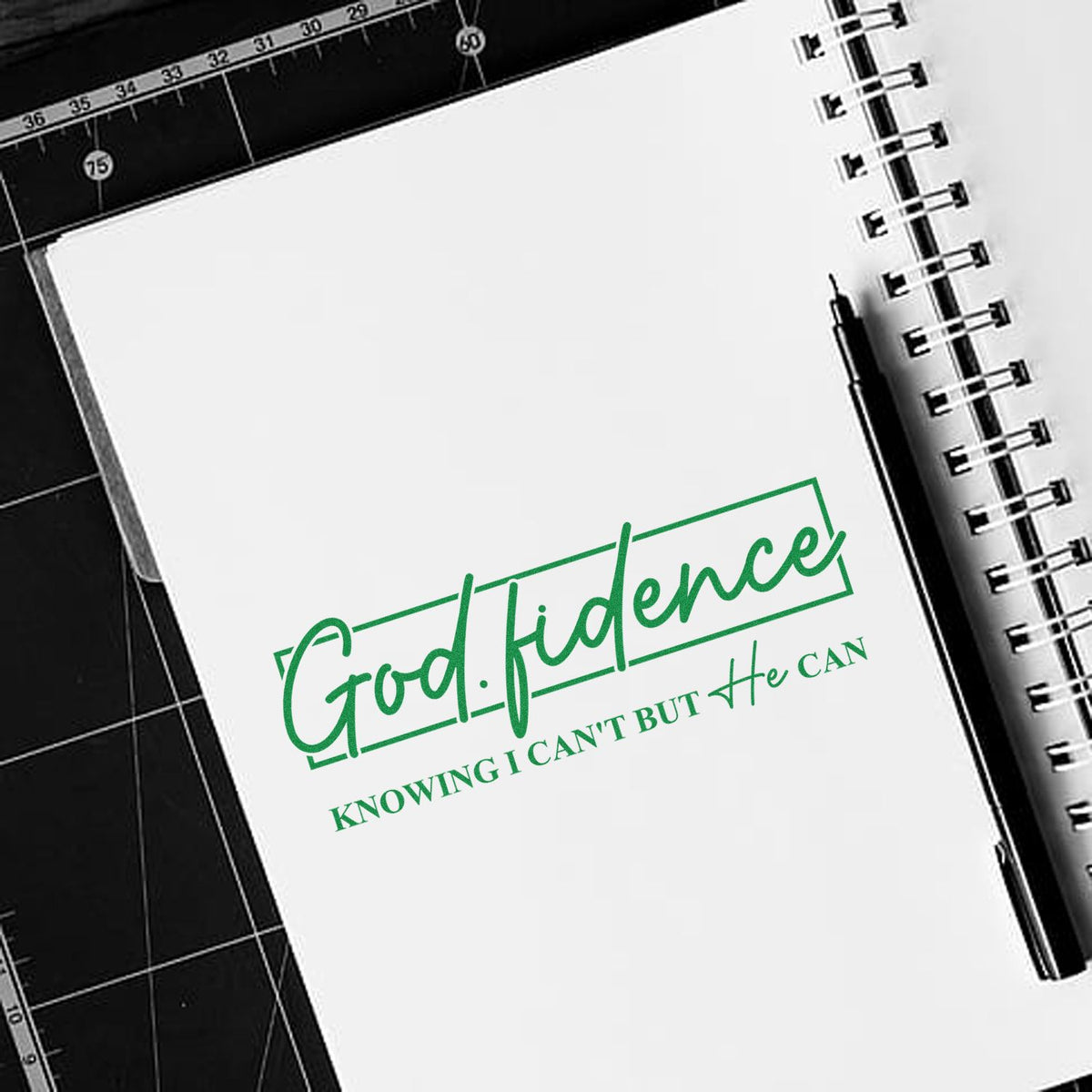 Christian rubber stamp reading God-fidence with Knowing I cant but He can on a notebook page.