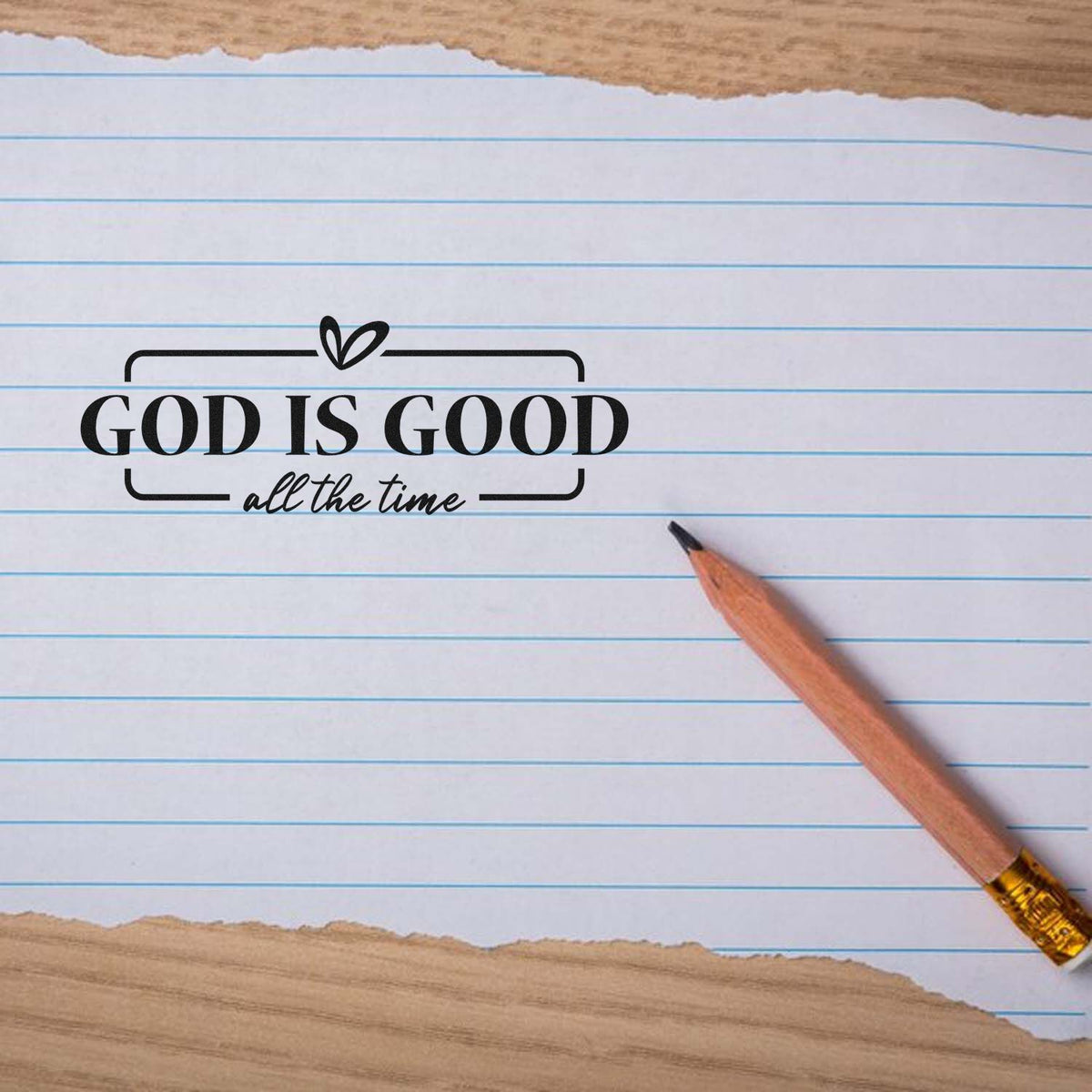 God is Good all the time rubber stamp design on lined paper with pencil, a Christian encouragement stamp for journaling and crafts.