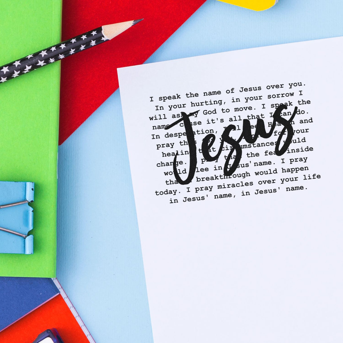Jesus rubber stamp over a Christian prayer page, ideal for faith-based journaling and handmade card projects.
