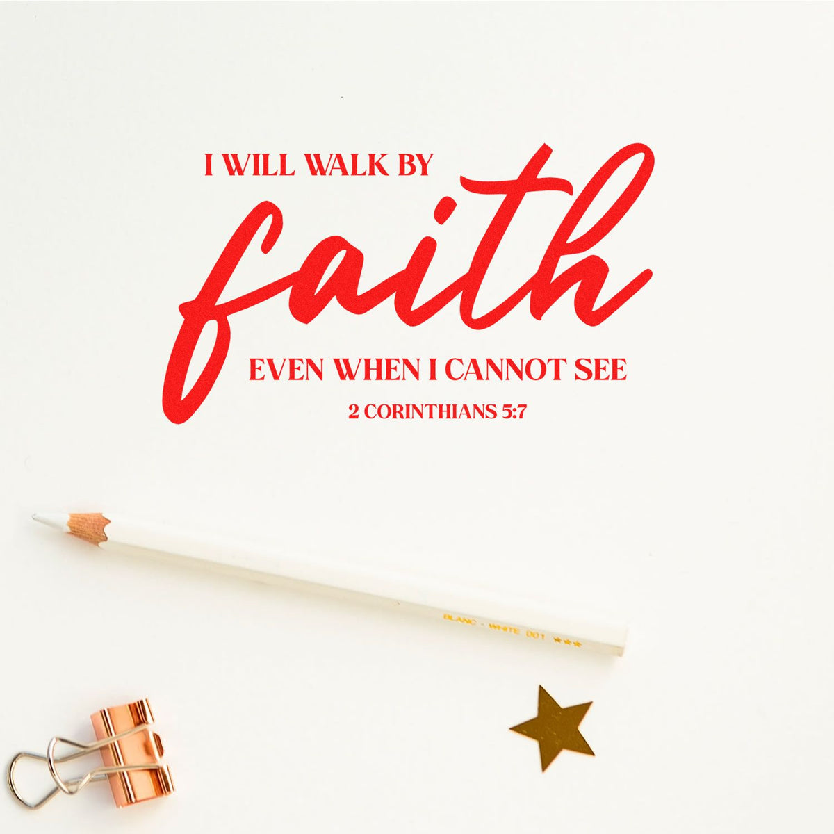Faith quote rubber stamp with red text, I will walk by faith even when I cannot see from 2 Corinthians 5:7, styled with pencil, binder clip and gold star.
