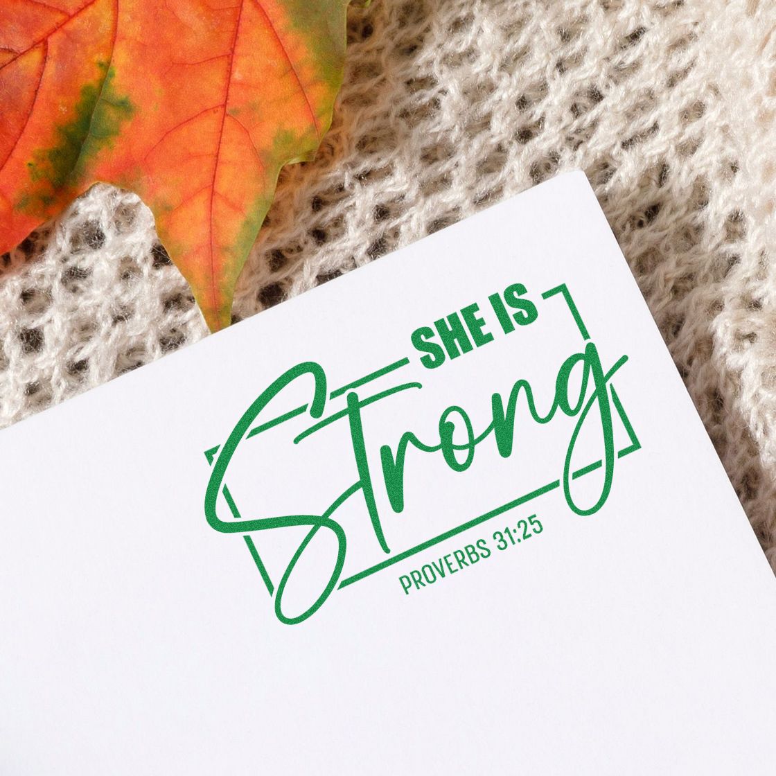 Green She is Strong Proverbs 31:25 rubber stamp impression on paper, ideal for faith-based stationery and gifts.