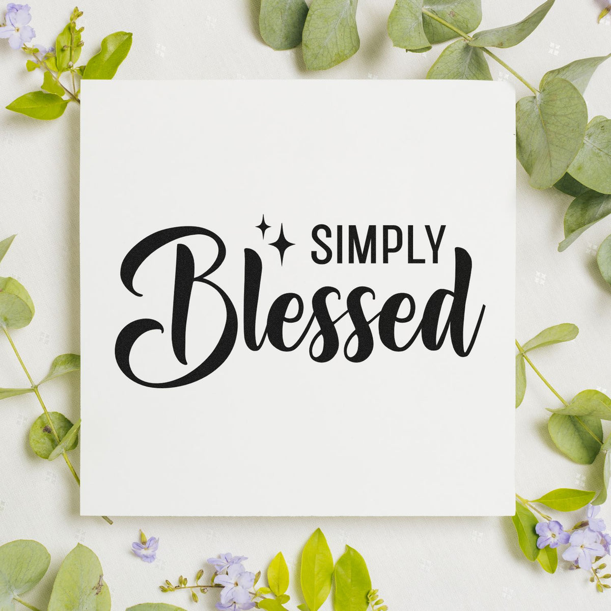 Simply Blessed rubber stamp design on white card with floral greenery, ideal for faith-based handmade cards and crafts.