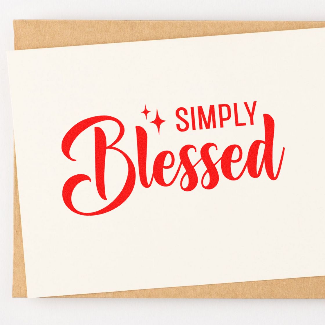 Simply Blessed red rubber stamp design on white cardstock for handmade cards and craft projects.