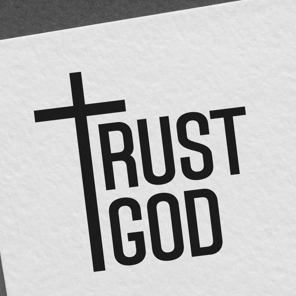 Trust God rubber stamp design with cross-shaped T, ideal for Christian crafts, stationery, and faith-based projects.