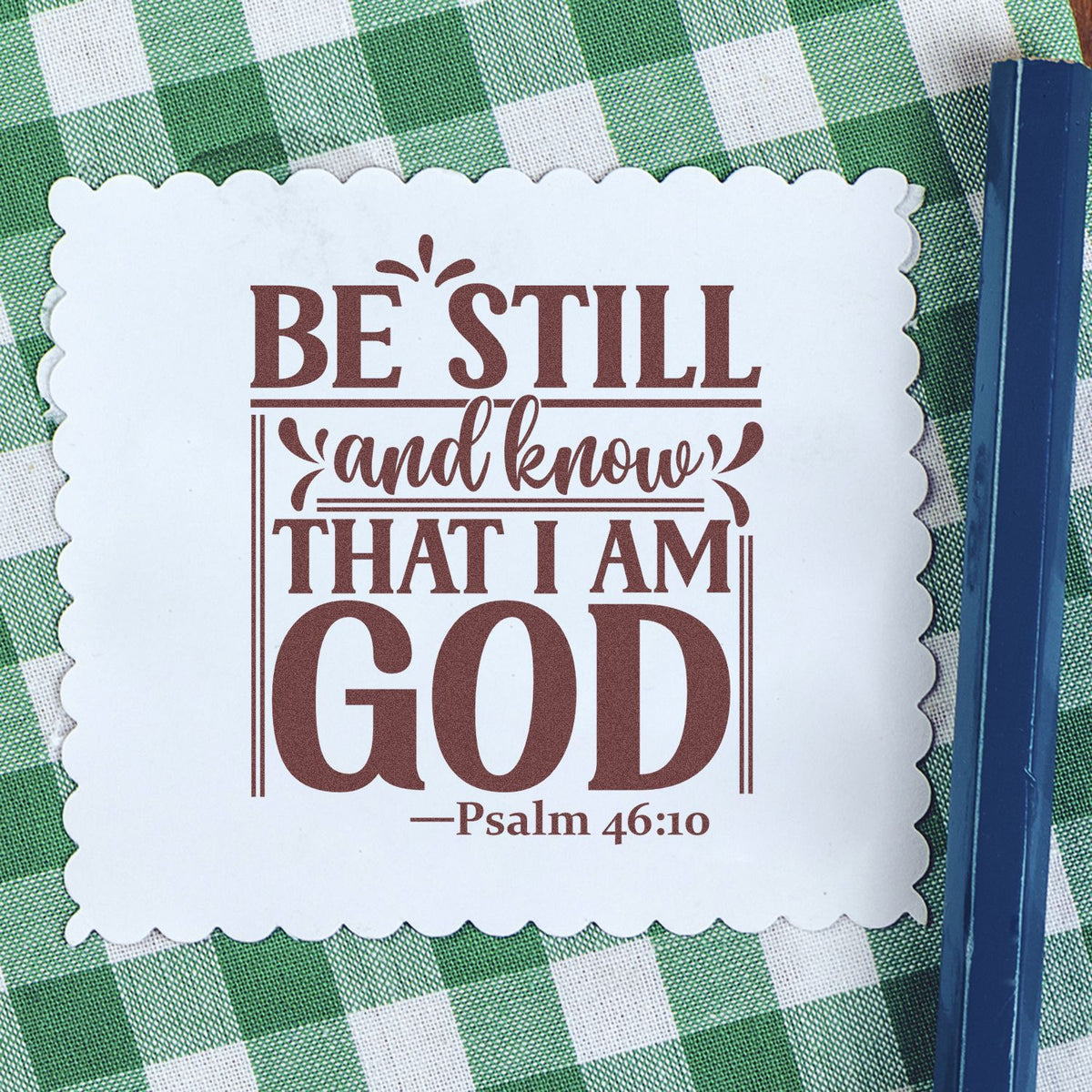 Christian rubber stamp design with Psalm 46:10, Be still and know that I am God, in decorative lettering.