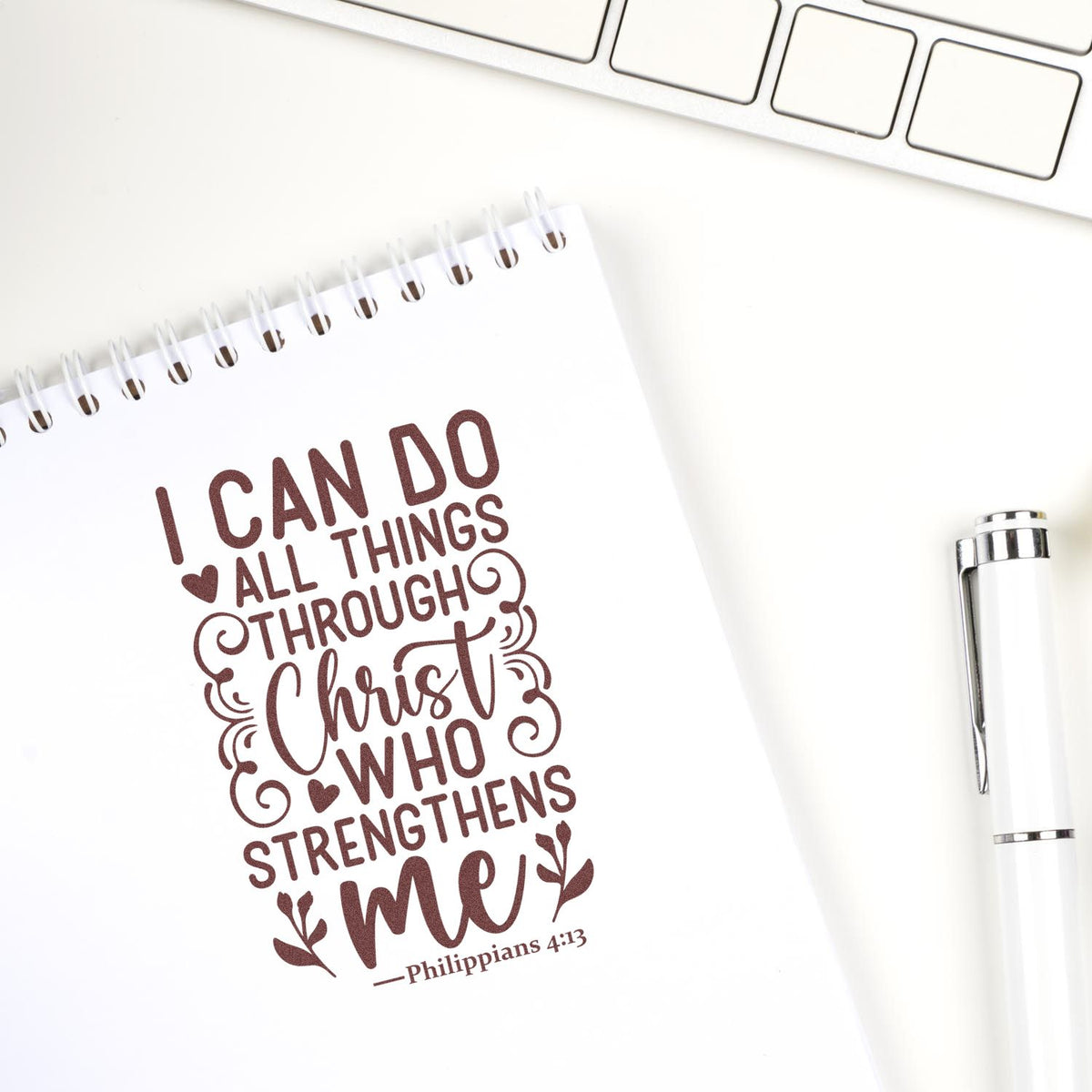 Christian rubber stamp design on notebook with Philippians 4:13 Bible verse: I can do all things through Christ who strengthens me.
