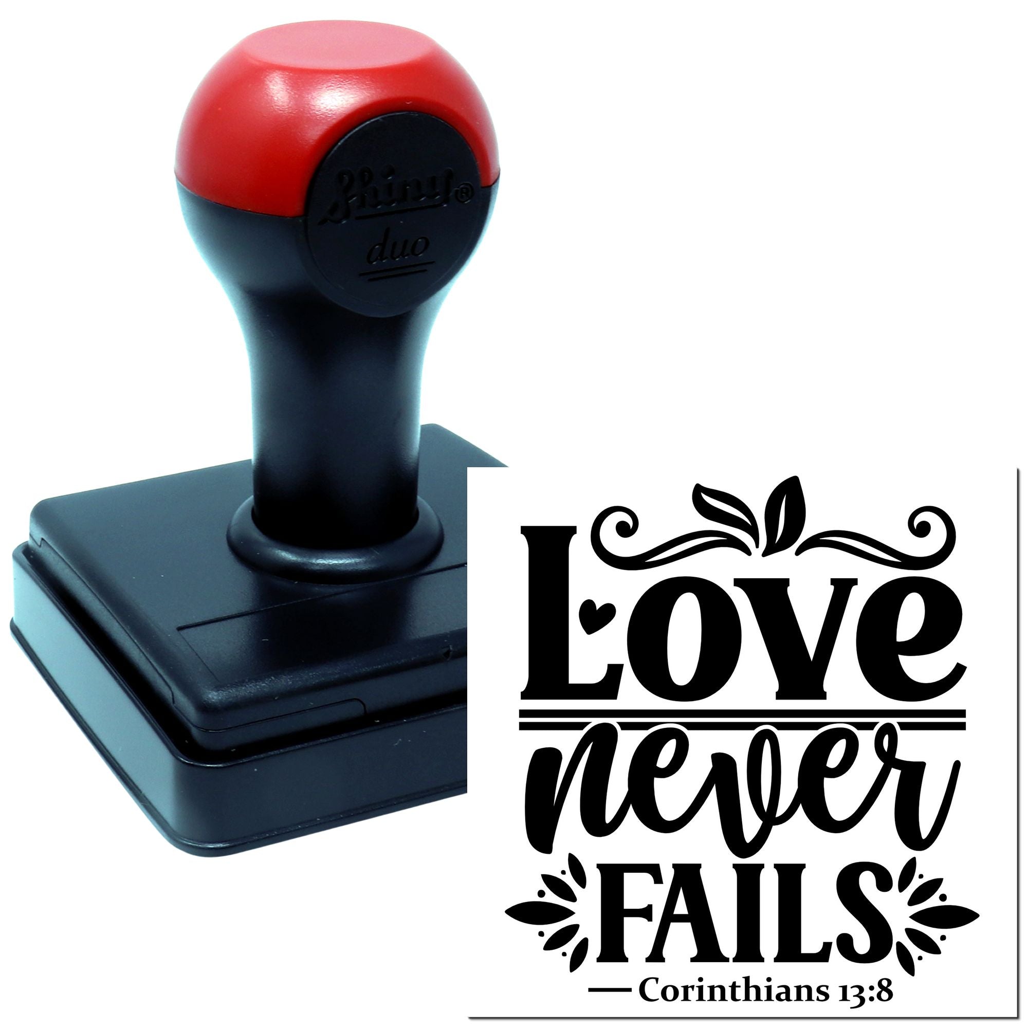 Self-inking rubber stamp with Love Never Fails Corinthians 13:8 design for faith-based crafts, cards, and paper goods.