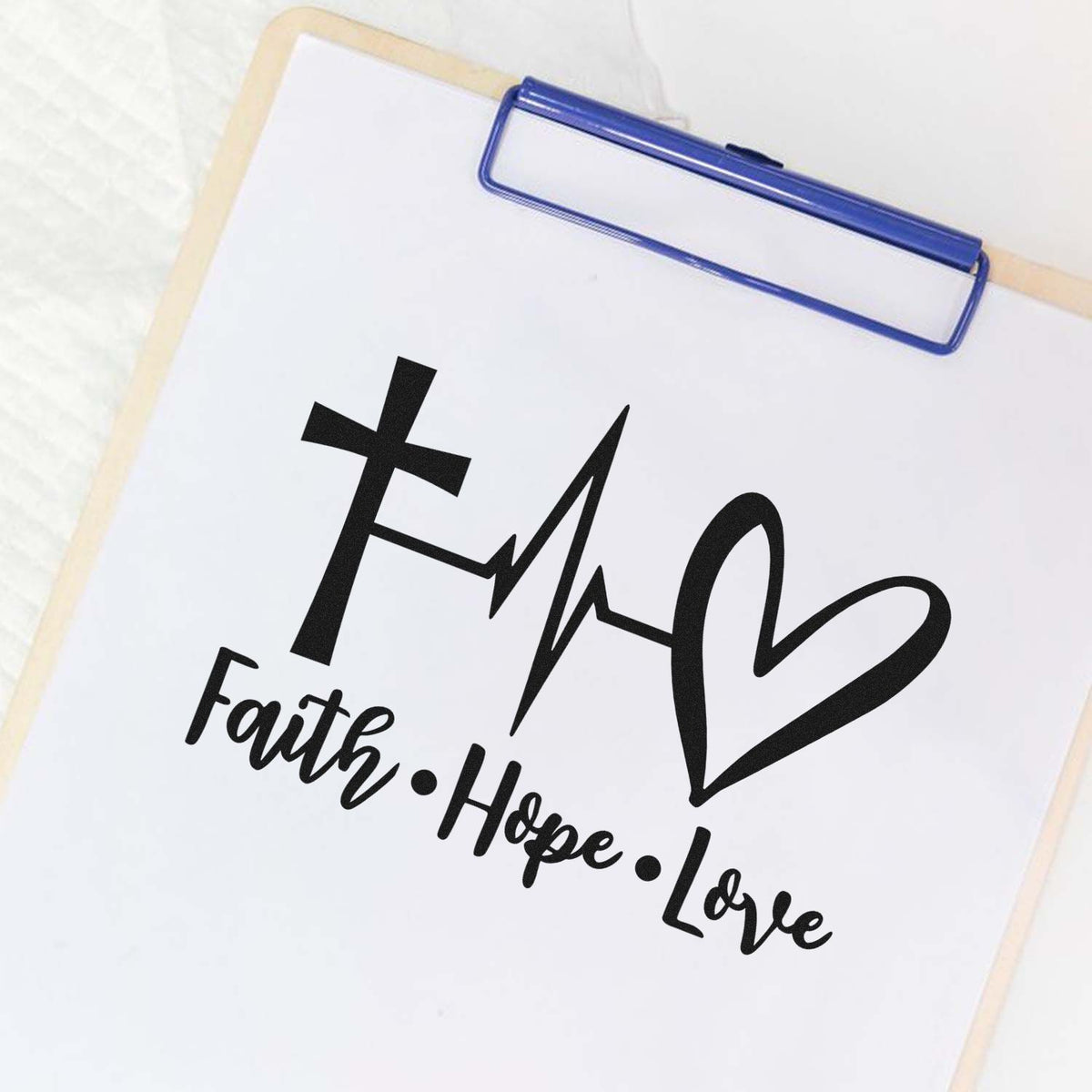 Faith Hope Love rubber stamp design on clipboard for inspirational cards, faith-based crafts, and custom stamping projects
