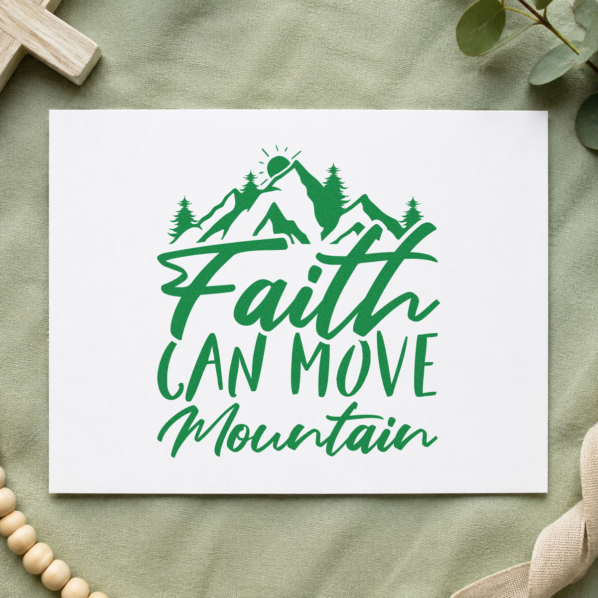 Faith Can Move a Mountain craft stamp imprint in green ink on a handmade project, one idea being framed lodge art.