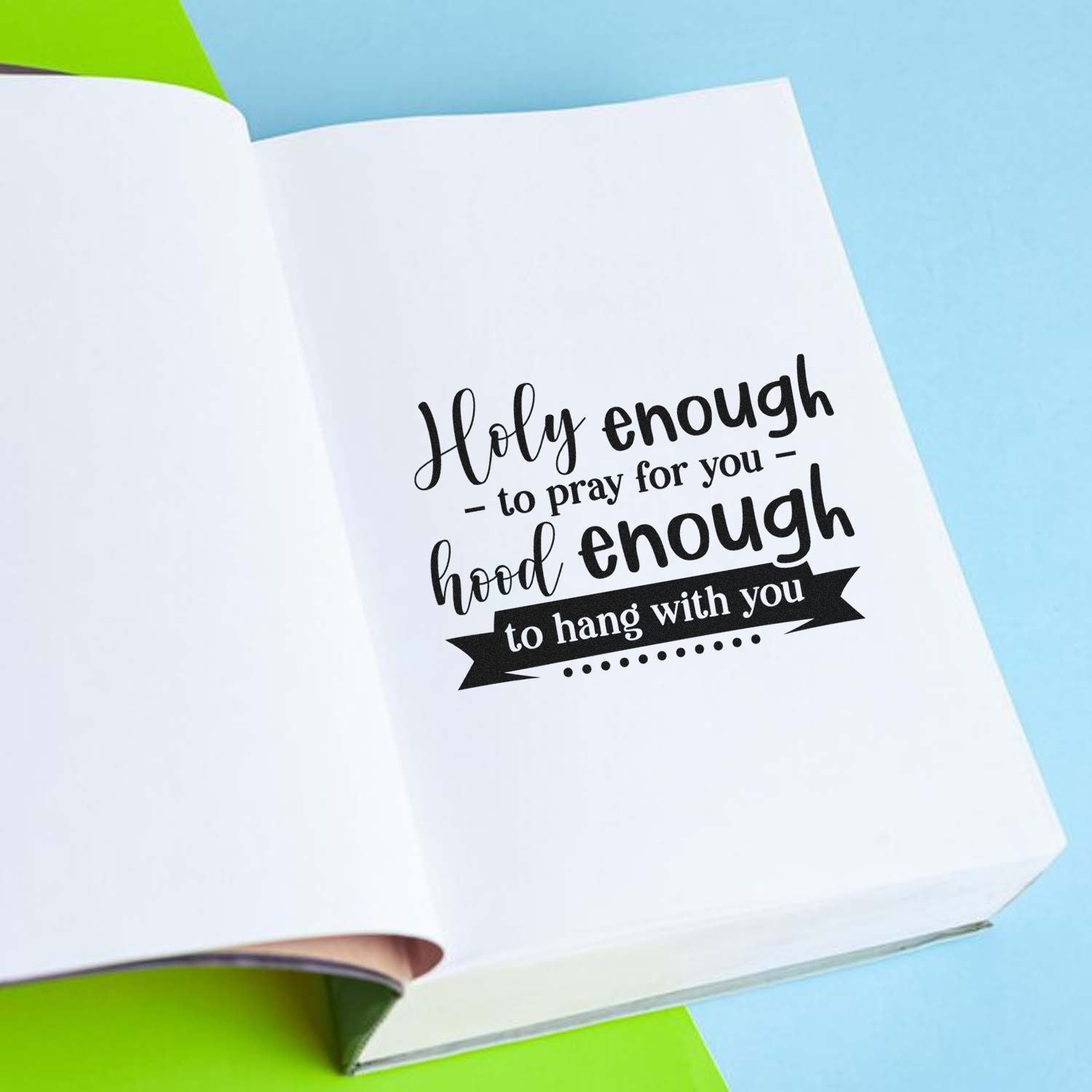 Custom rubber stamp with funny Christian quote, Holy enough to pray for you, hood enough to hang with you, on notebook page.