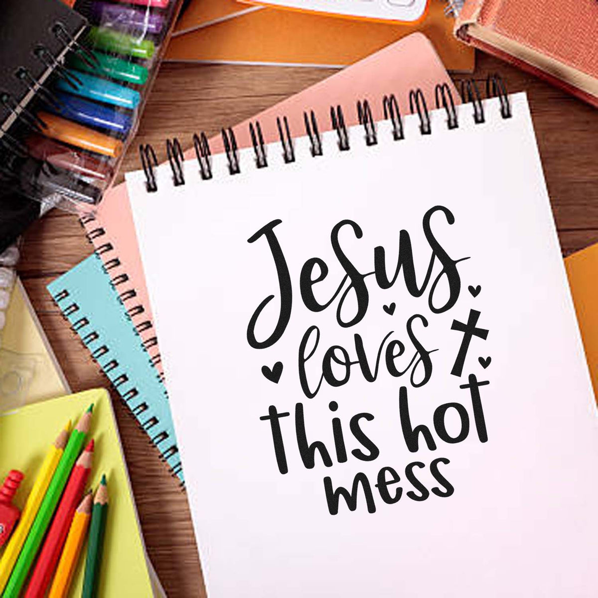 Jesus Loves This Hot Mess rubber stamp design on notebook with colorful school supplies
