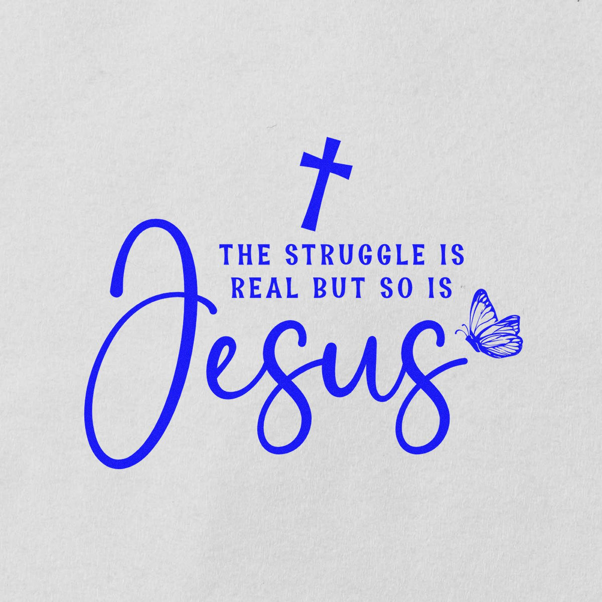Blue Christian rubber stamp design with cross and butterfly, reading The struggle is real but so is Jesus.