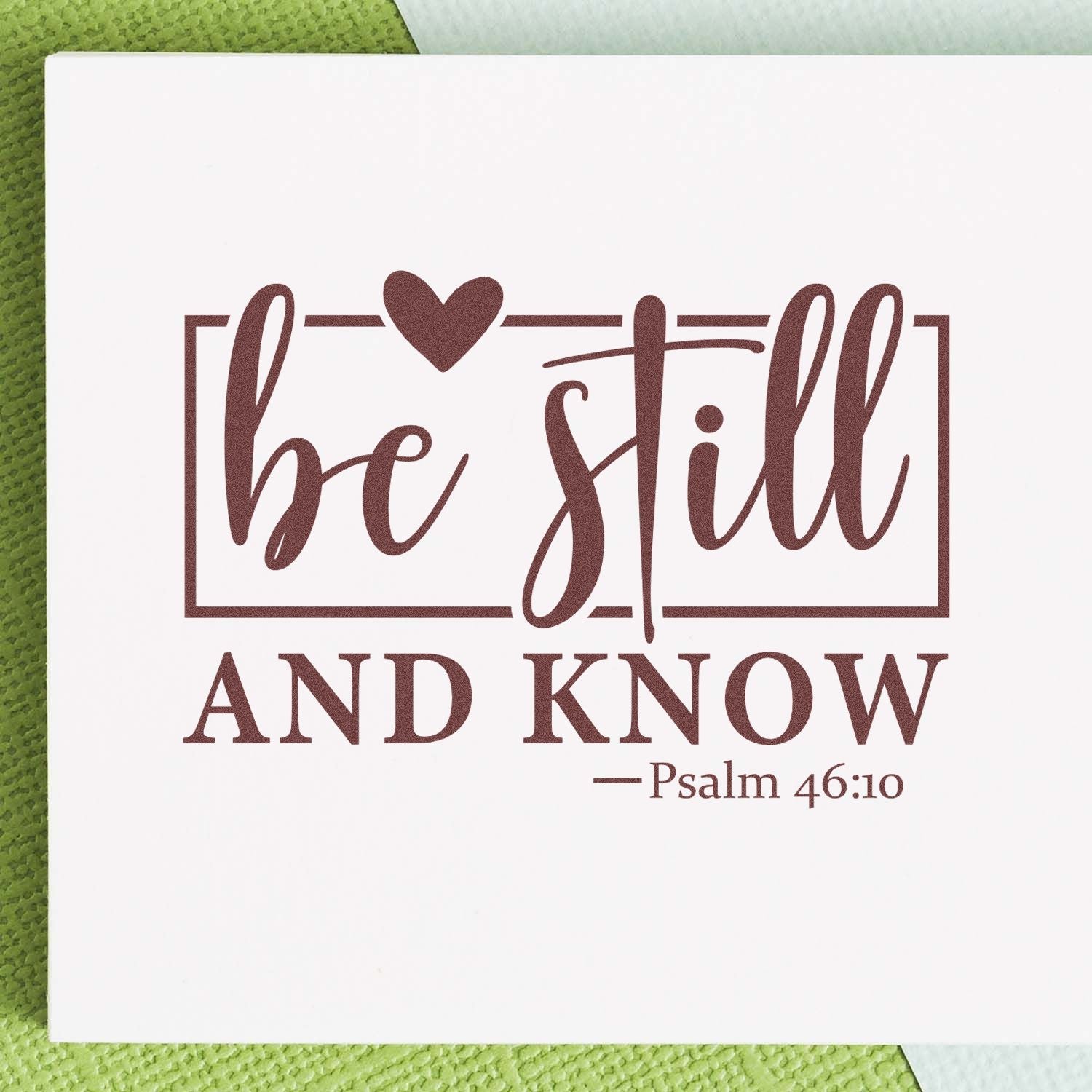 Christian rubber stamp design reading Be Still and Know with heart accent and Psalm 46:10 verse.