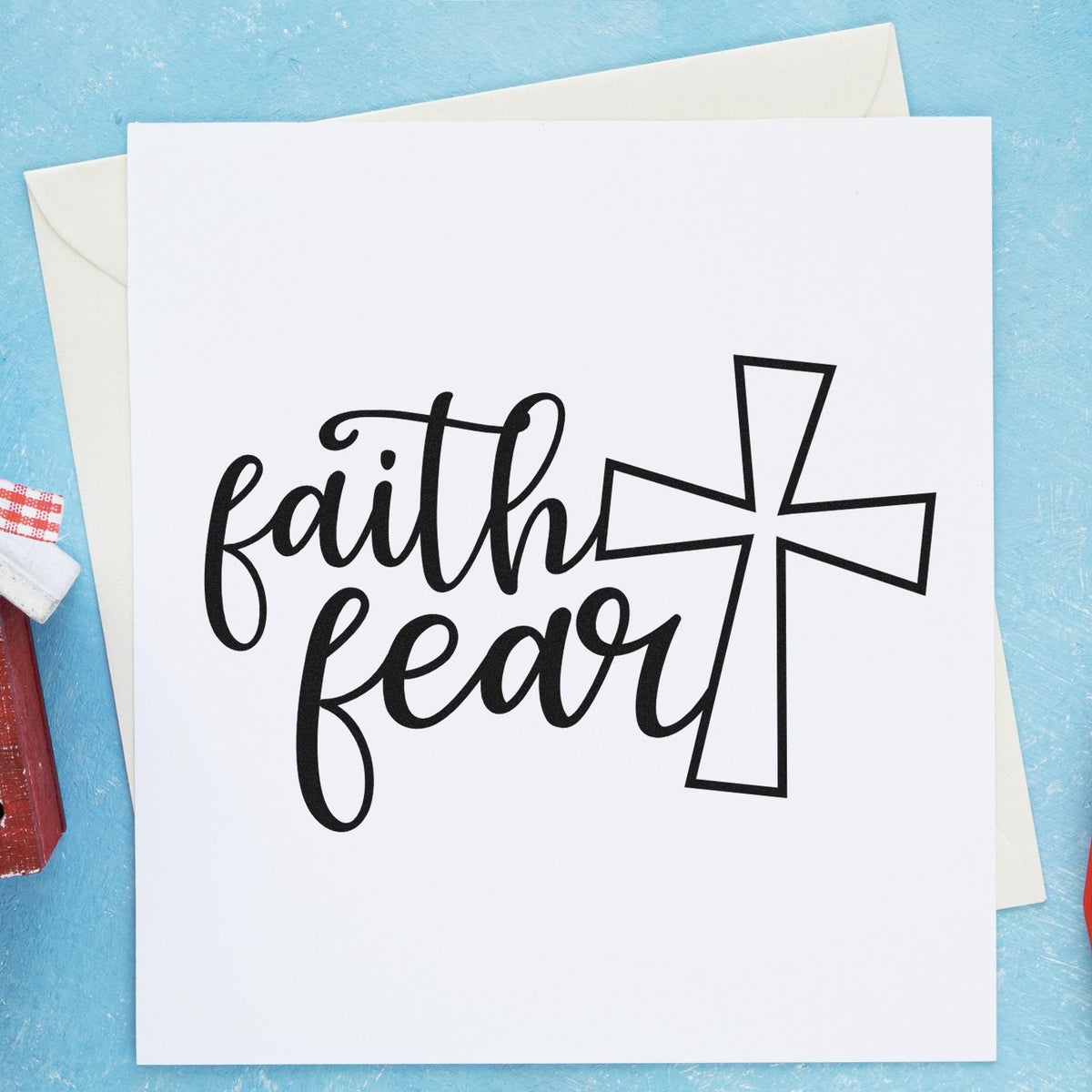 Faith over fear Christian rubber stamp design with cross on blank greeting card for inspirational handmade cards.
