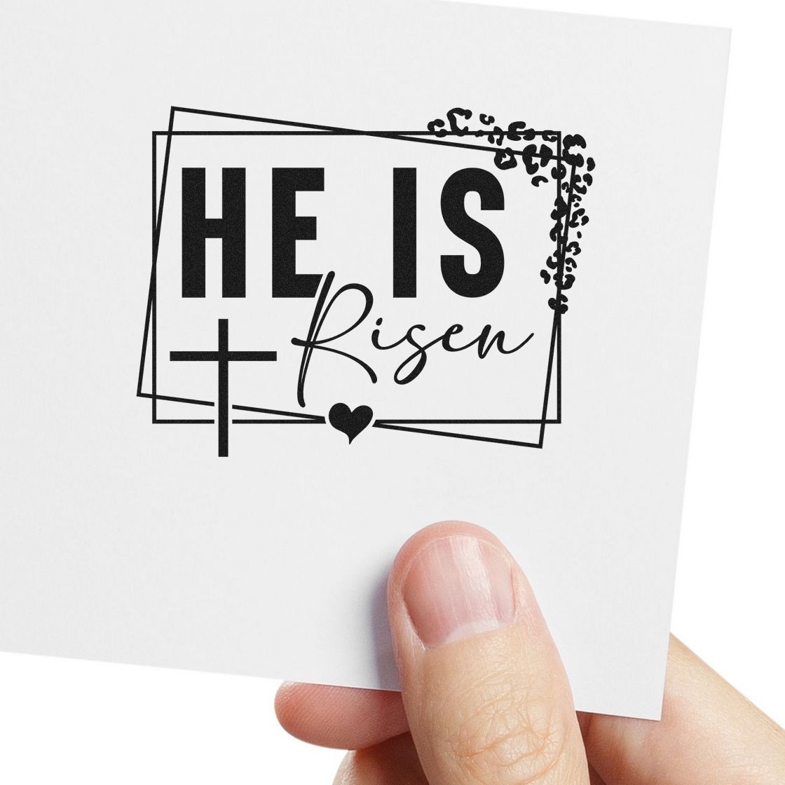 Christian Easter rubber stamp design with He Is Risen, cross, heart, and decorative frame for faith crafts.