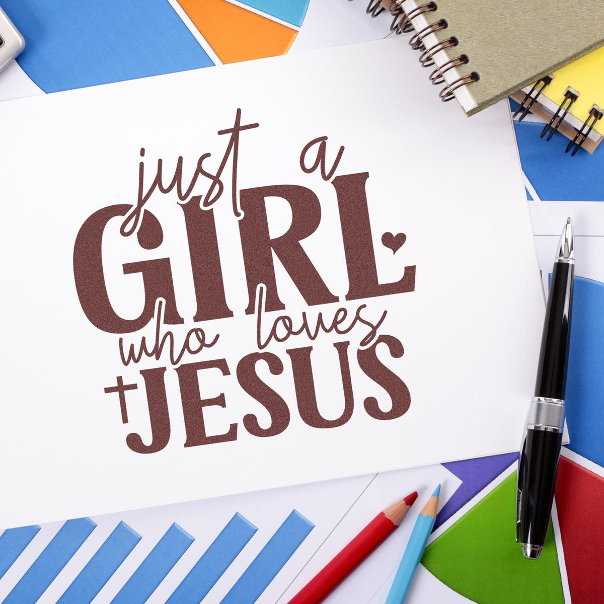 Custom Christian rubber stamp design with Just a Girl Who Loves Jesus quote on a stationery flat lay, ideal for faith-based crafts.