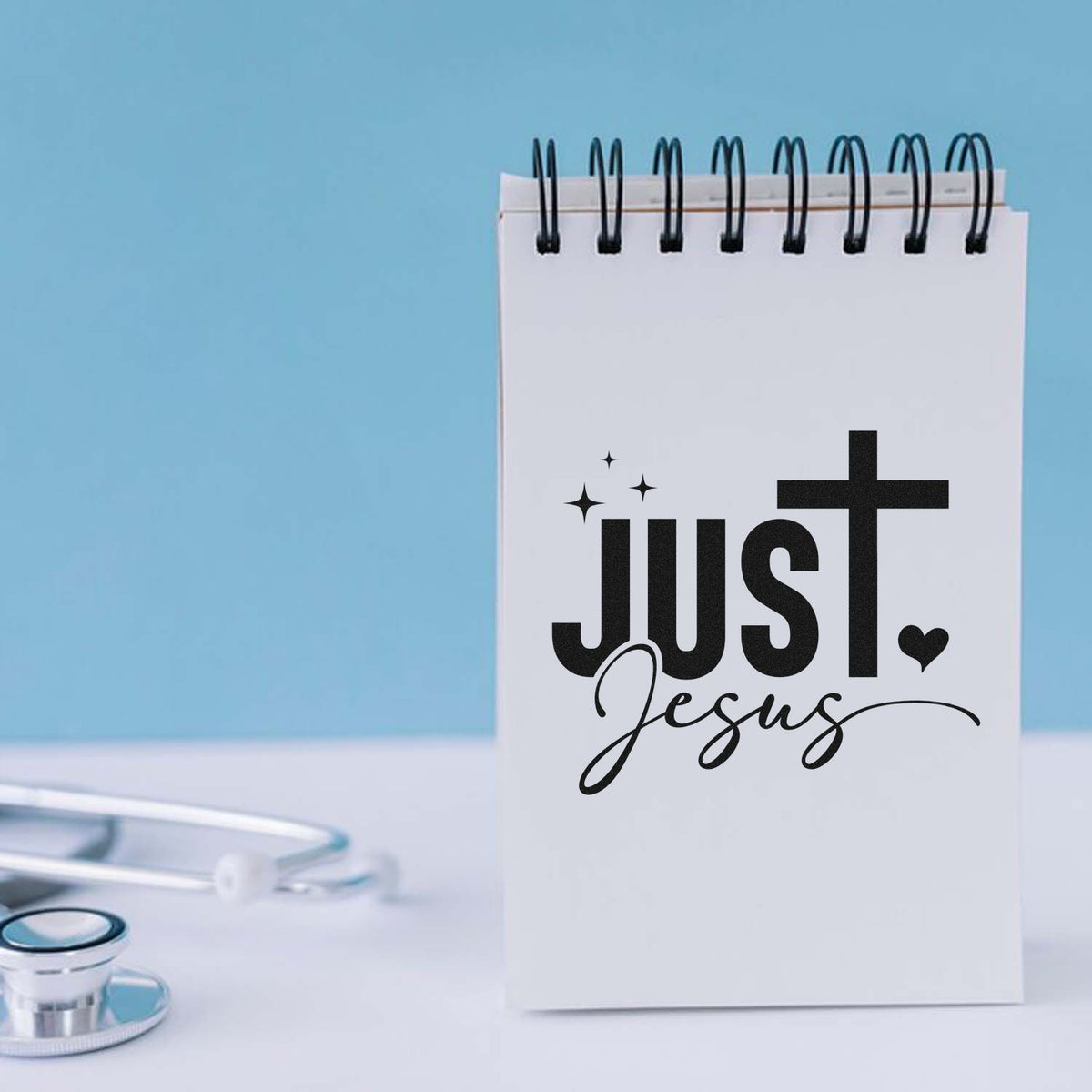 Just Jesus rubber stamp design on spiral notebook, perfect for Christian nurse gifts and faith-based medical stationery.