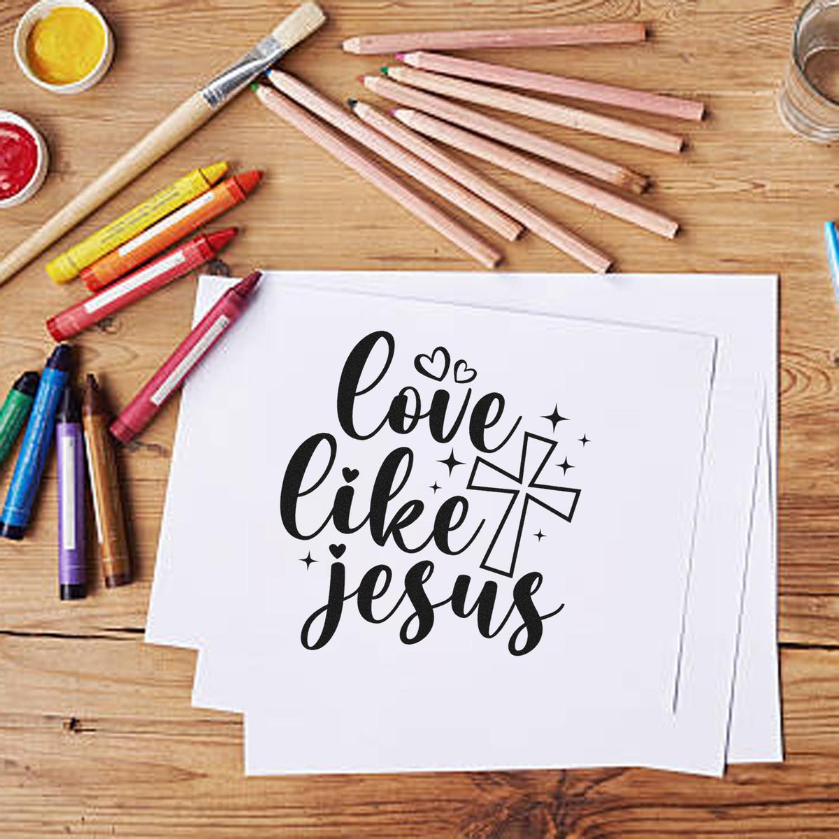 Christian rubber stamp design reading Love Like Jesus with cross and hearts for Bible journaling, cards, and DIY crafts.